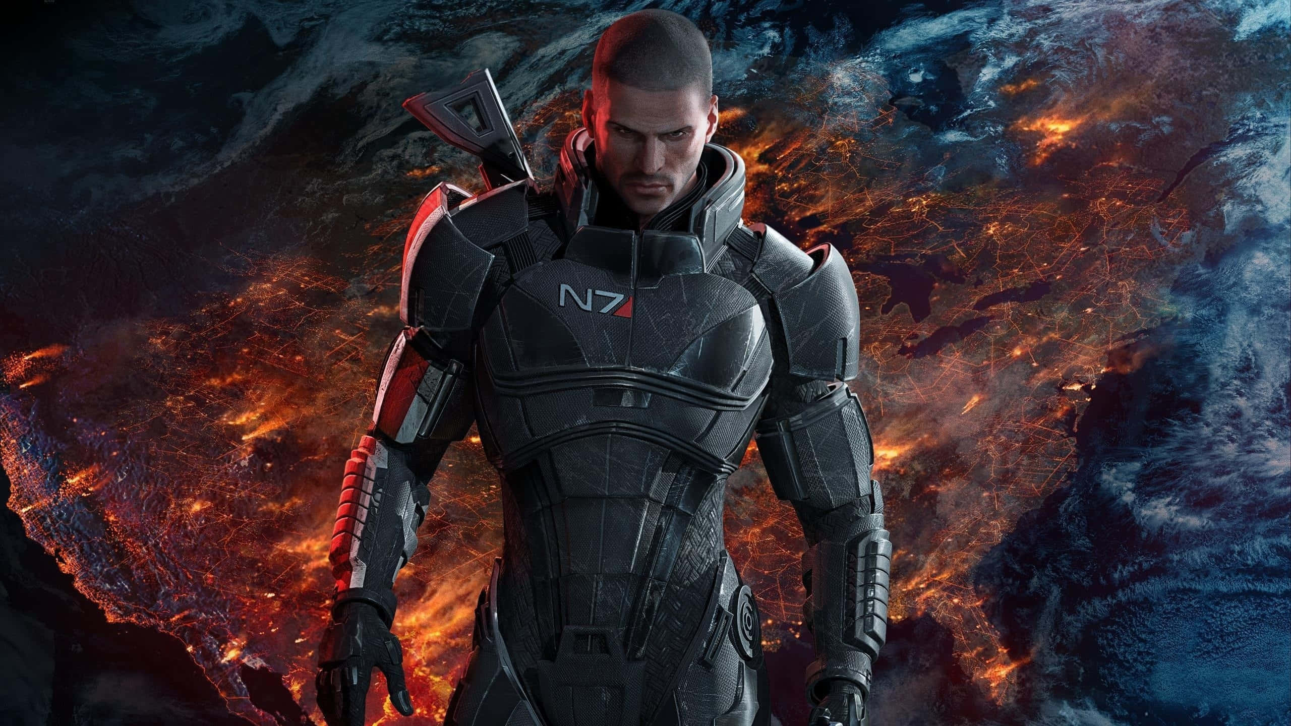 Mass Effect Legendary Edition 桌布 壁紙 — 一個嚴肅的士兵穿著黑色N7裝甲，站在一個熾熱熔化的行星前，有發光的橙色熔岩河流。