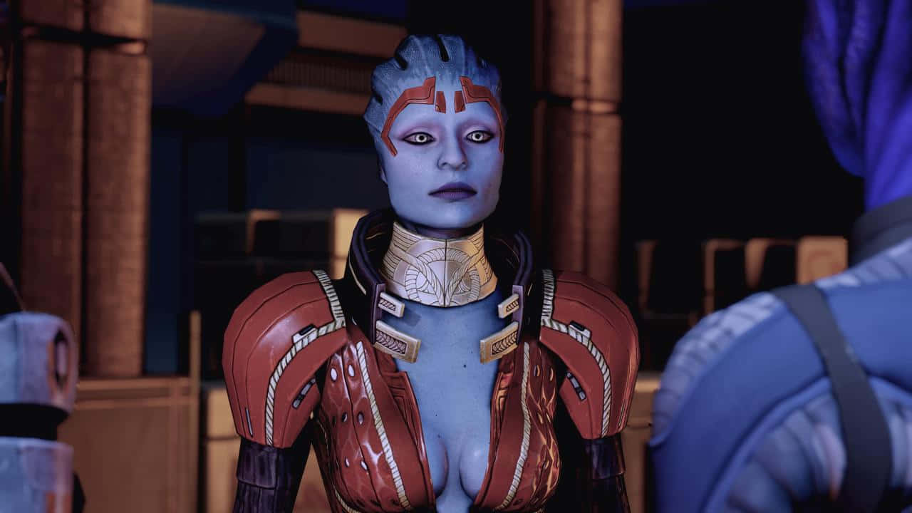 Mass Effect Samara 桌布 壁紙 — 一個藍皮膚的外星女人穿著紅色裝甲背心，站在一個光線昏暗、帶有溫暖環境照明的科幻室內。