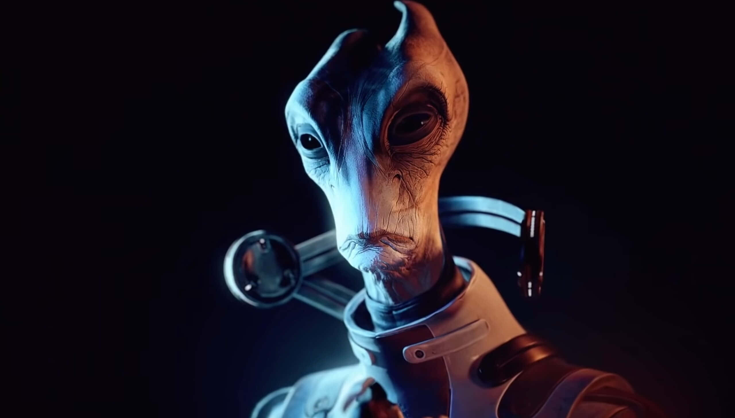 Mass Effect Legendary Edition 桌布 壁紙 — 一個類人外星人的特寫，有大眼睛和皺紋皮膚，被藍光照亮，背景為黑色。