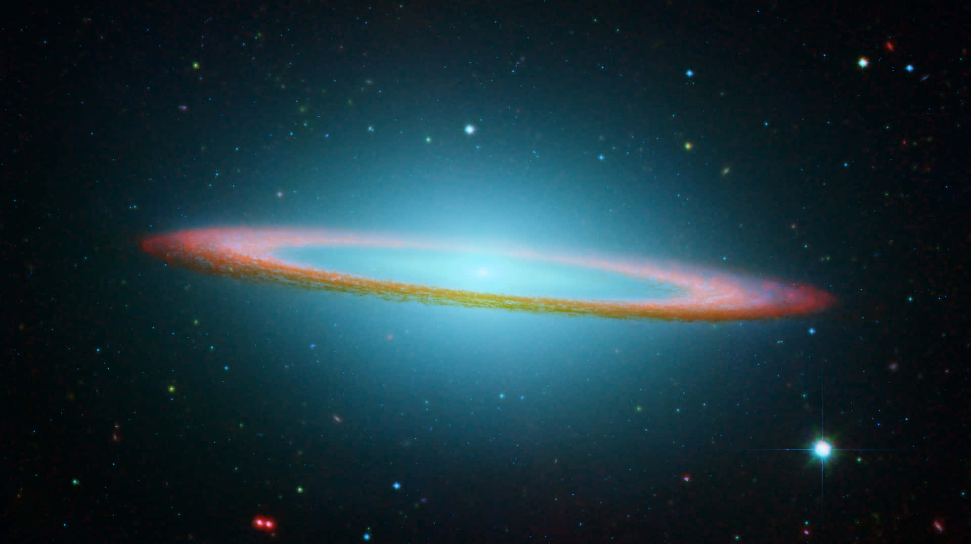  壁紙 — 一個令人驚嘆的螺旋星系在深空的星場中發出藍色和紅色的光芒。