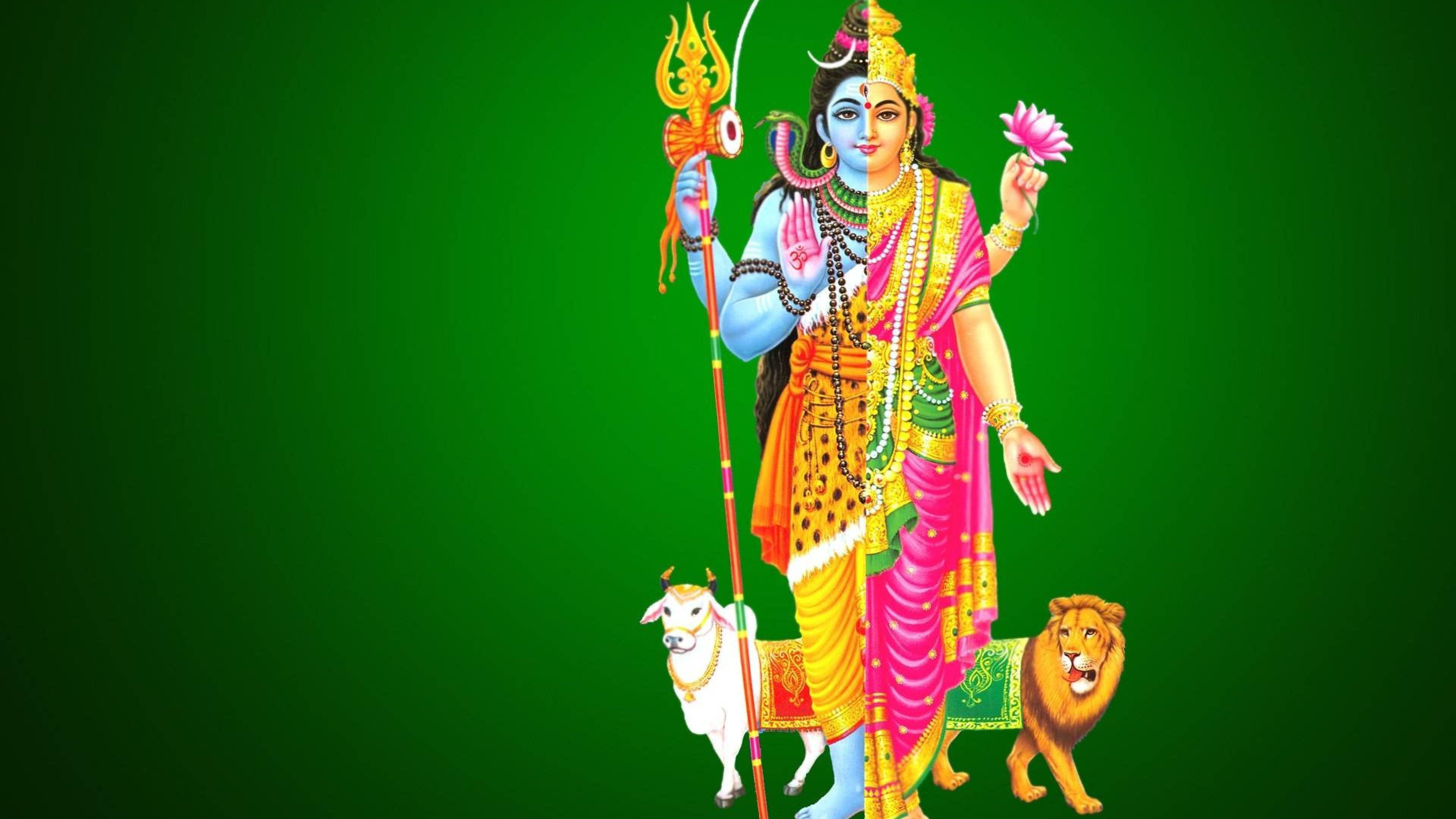 Lord Shiva 桌布 壁紙 — 印度教神祇濕婆的鮮明插圖，威嚴地站立，手持三叉戟和粉紅蓮花，兩側有獅子和公牛，背景為純綠色。
