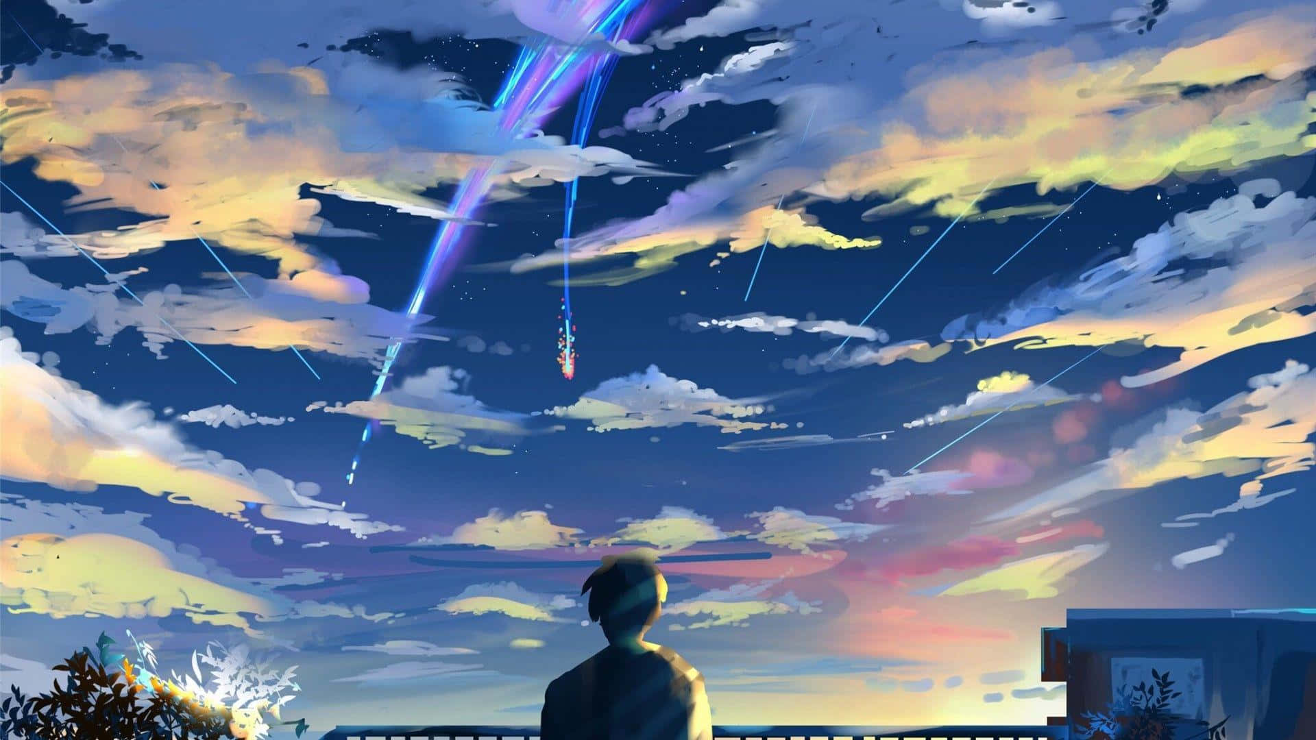 從屋頂觀看暮色天空中多彩宇宙痕跡的人。