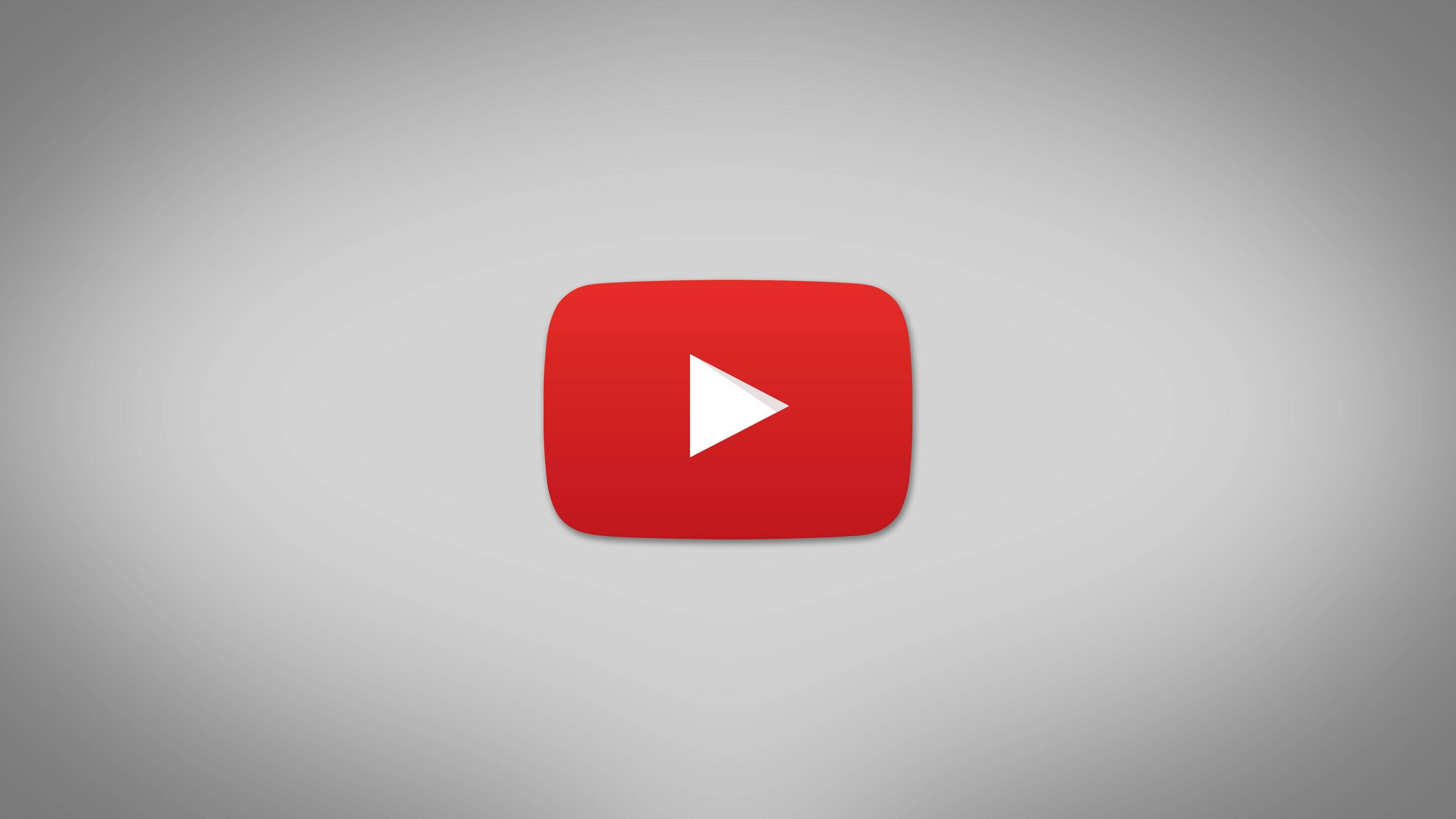 時尚YouTube極簡紅色播放按鈕標誌 壁紙 — 一個大膽的紅色 YouTube 播放按鈕圖示，居中在柔和的灰色漸變背景上。