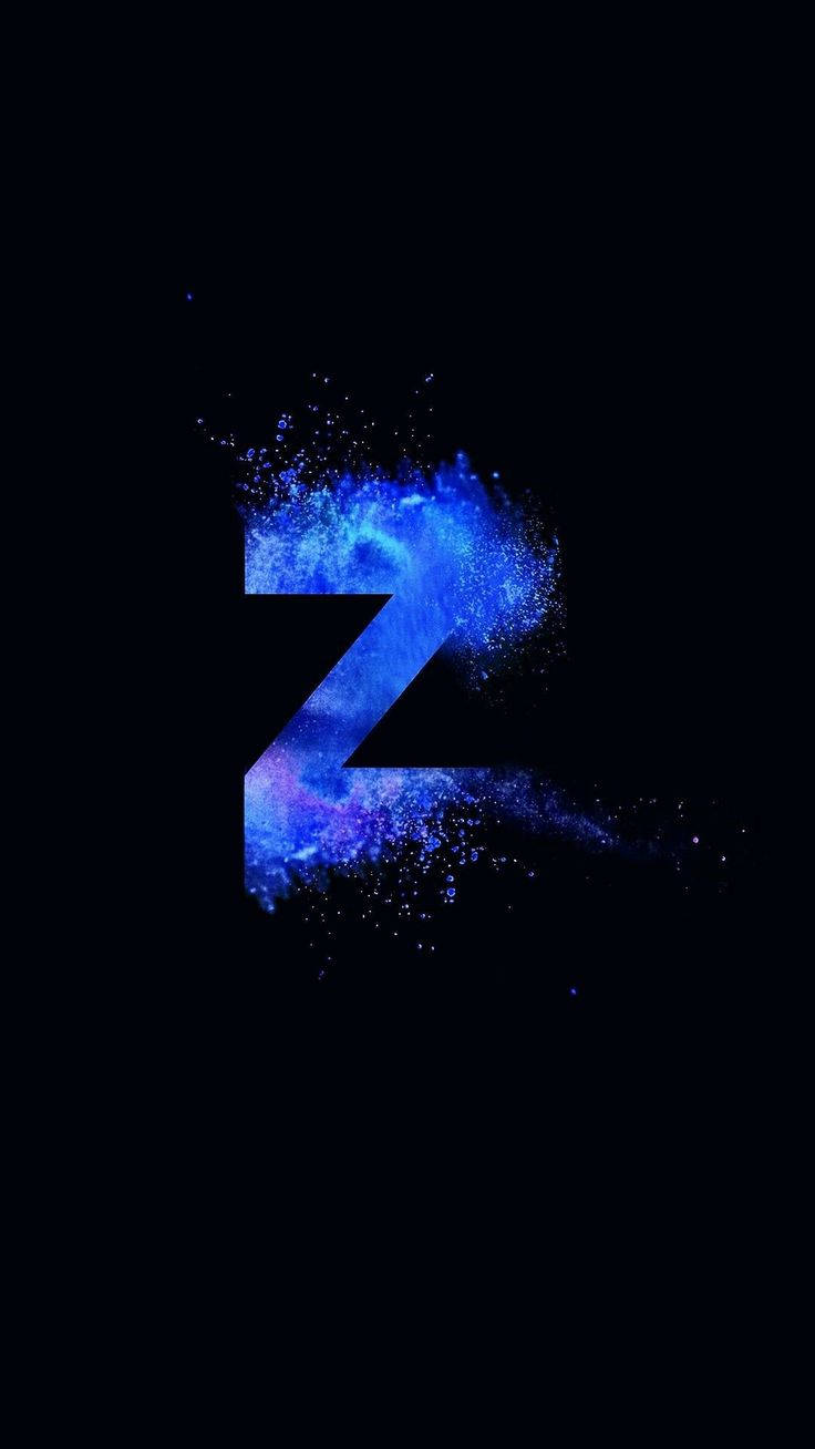 藍色粉末字母Z 壁紙 — 一個發光的藍色宇宙字母Z，在黑色虛空中迸發出星塵。