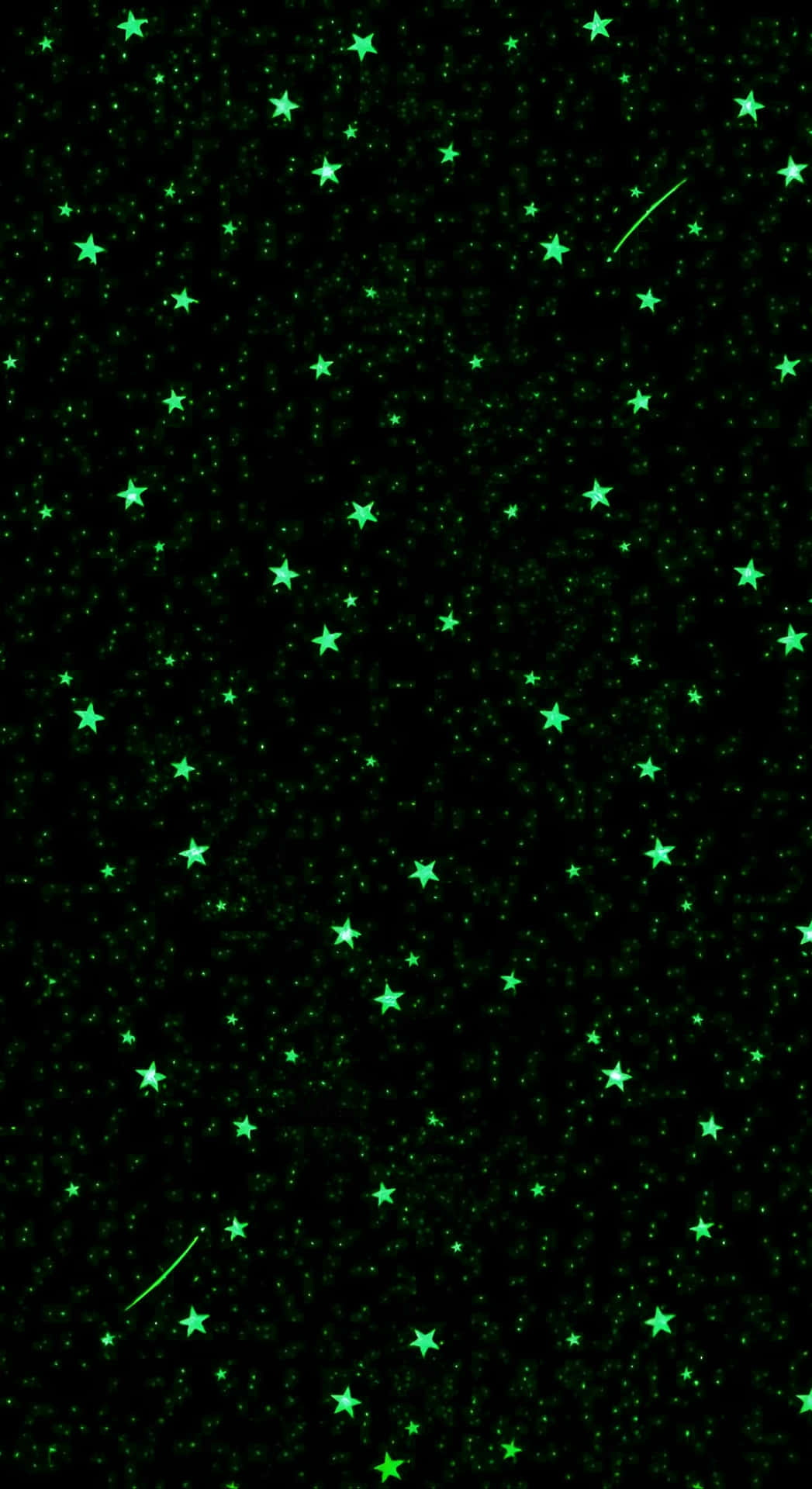  壁紙 — 在深邃黑色宇宙背景下，一片迷人的發光綠色星星和流星場。