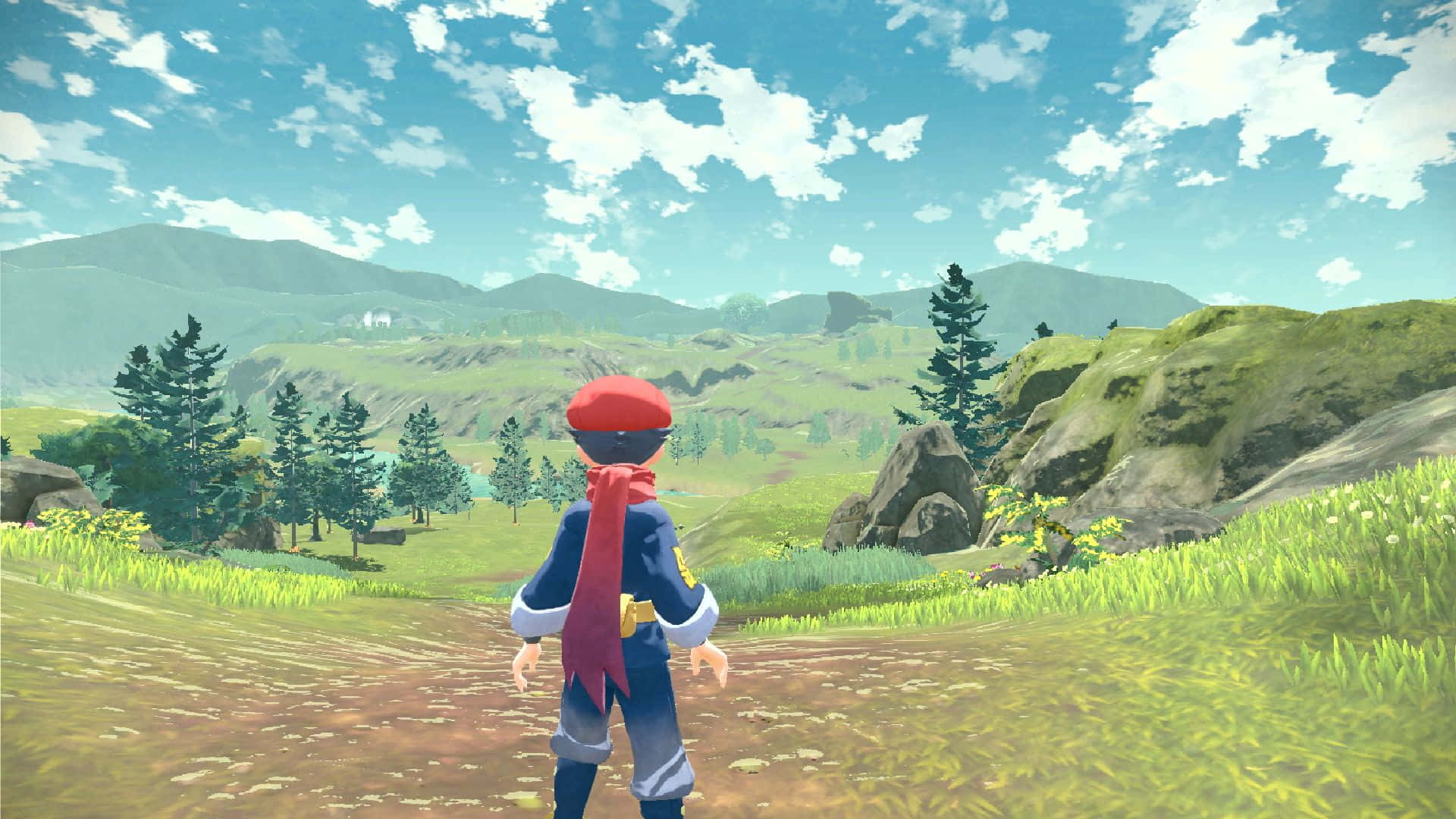 Pokemon Virtual World 桌布 壁紙 — 一位戴紅帽的探險家站在長滿青草的山丘上，俯瞰著一個充滿活力的山谷，遠處有山脈和散落的松樹，天空湛藍明亮。