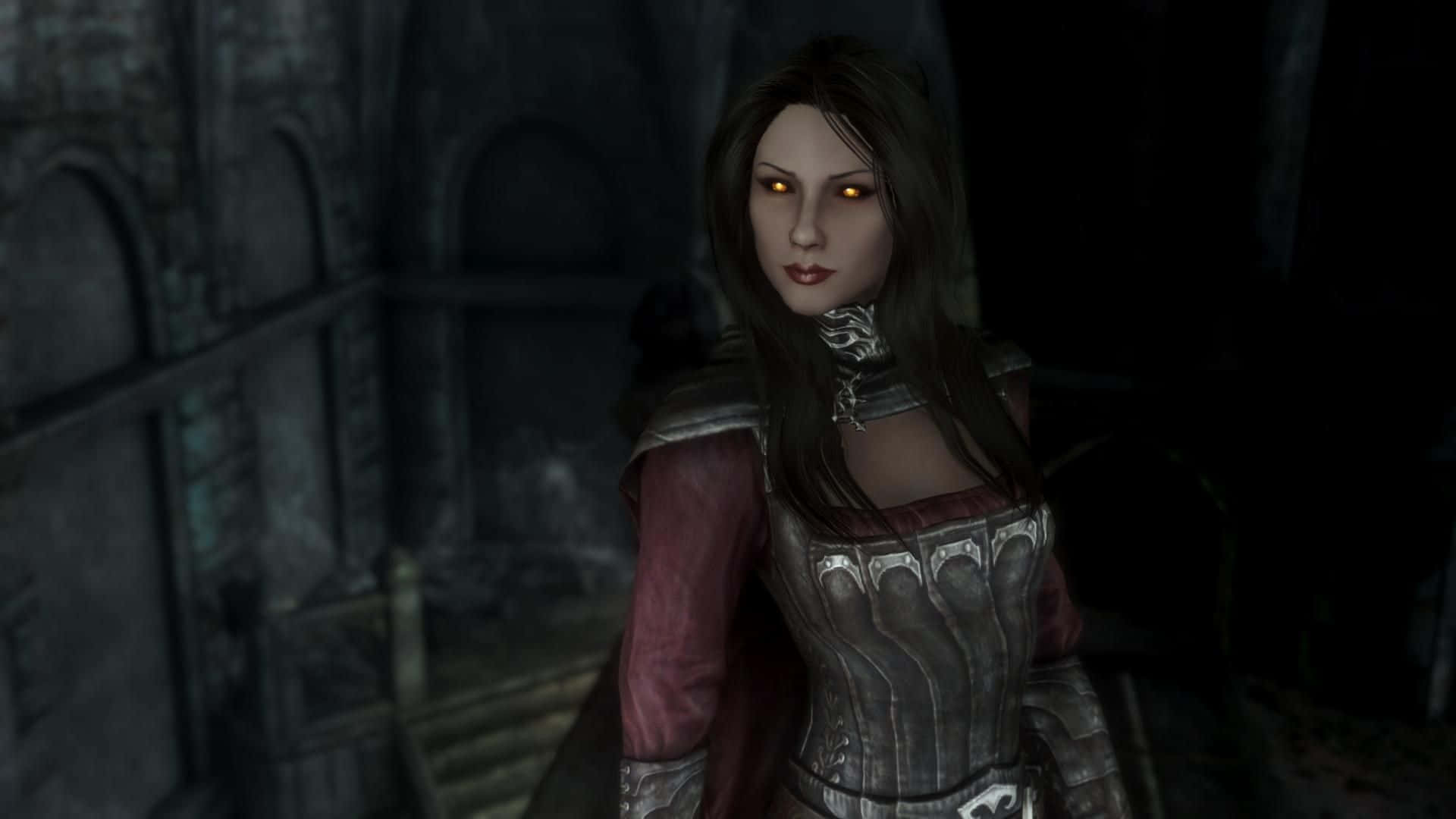 Skyrim Serana 桌布 壁紙 — 一位擁有橙色發光眼睛和華麗盔甲的黑暗奇幻女性，站在陰暗的石頭廢墟中。