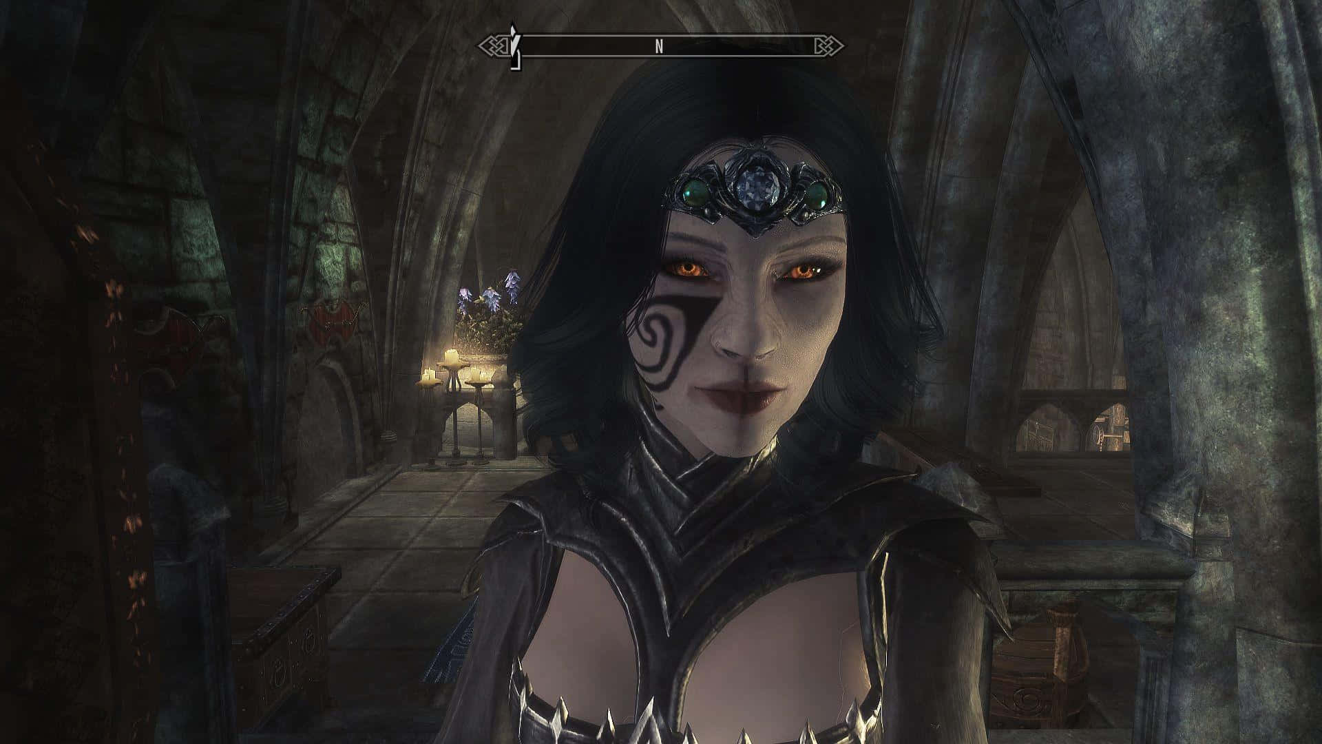 Skyrim Dawnguard 桌布 壁紙 — 一位深色頭髮的精靈，擁有發光的橙色眼睛和華麗的頭飾，站在一個昏暗的石頭大教堂中，拱形天花板和閃爍的火把。
