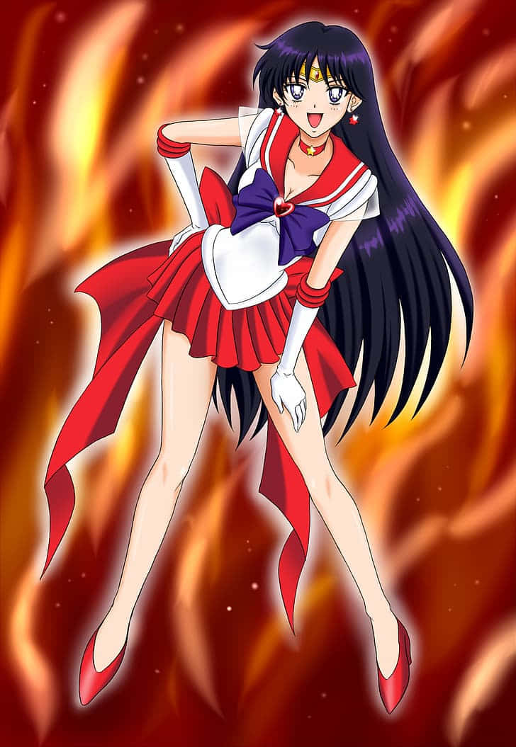 sailor mars 桌布 壁紙 — 一位火紅頭髮的動漫女孩，身穿紅白水手服，在熾熱的橙紅色火焰背景前動感地擺姿勢。