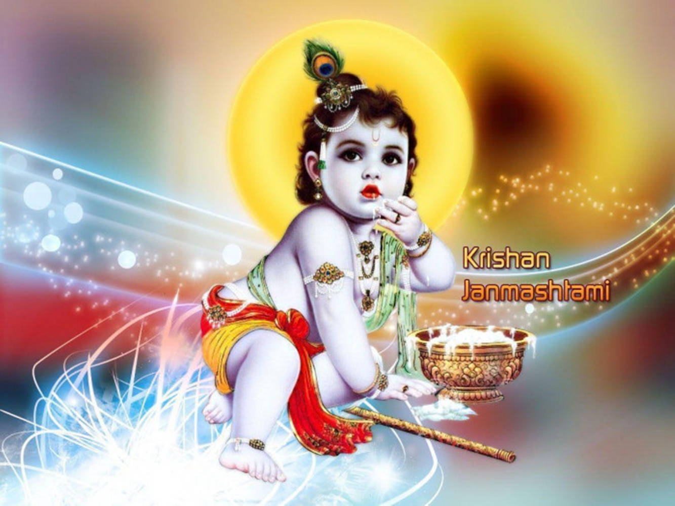 Indian 桌布 壁紙 — 一位神聖的嬰兒克里希納戴著孔雀羽毛皇冠，坐在一個點燃的碗旁邊，手持長笛，背景是燦爛的金色光環和色彩繽紛的宇宙漩渦。