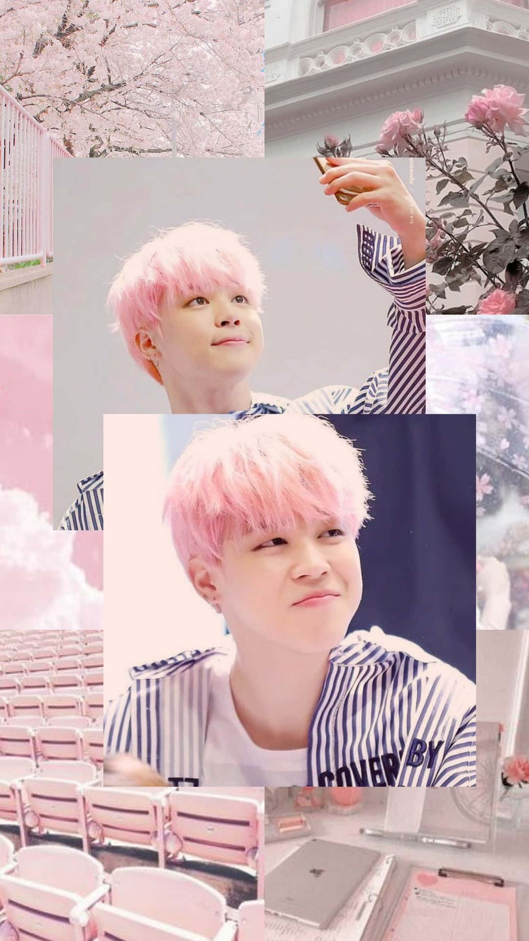 Jimin Aesthetic 桌布 壁紙 — 一位粉紅色頭髮嘅人喺一個夢幻嘅拼貼畫中溫柔咁微笑，拼貼畫包含櫻花、玫瑰同埋空嘅劇院座位，沐浴喺柔和嘅粉紅色燈光下。