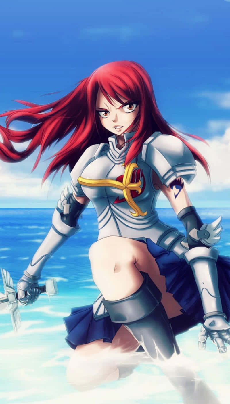 erza scarlet 桌布 壁紙 — 一位紅髮動漫戰士身穿銀色盔甲，在海灘上擺好姿勢，身後是海洋和天空。