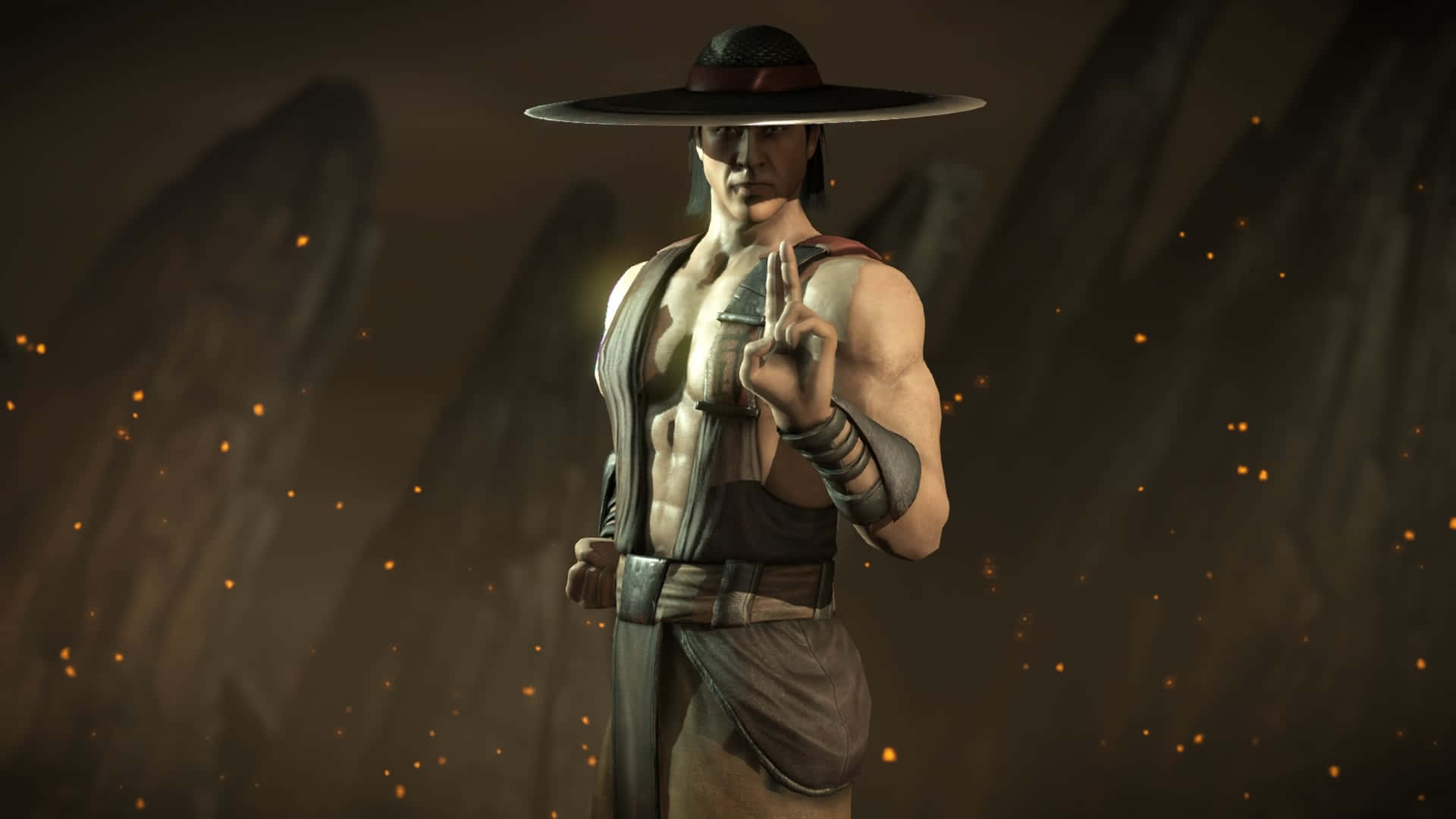 Mortal Kombat Kung Lao 桌布 壁紙 — 一位肌肉發達的武術家戴著寬邊帽，在黑暗岩石背景中閃爍餘燼的襯托下，擺出姿勢並做出手勢。