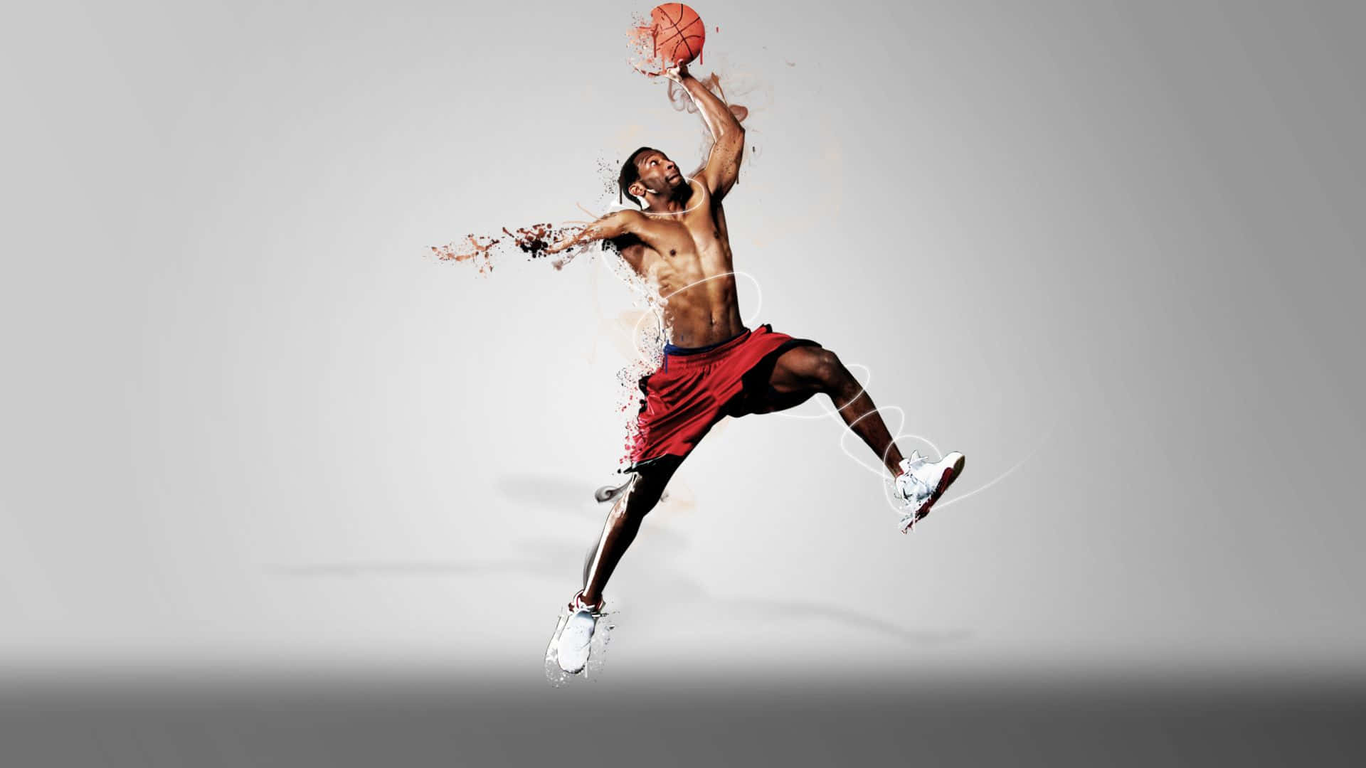 3d Sports 桌布 壁紙 — 一位肌肉發達的籃球運動員在灰色背景前，手持籃球，動態地躍起，帶有油漆飛濺效果。