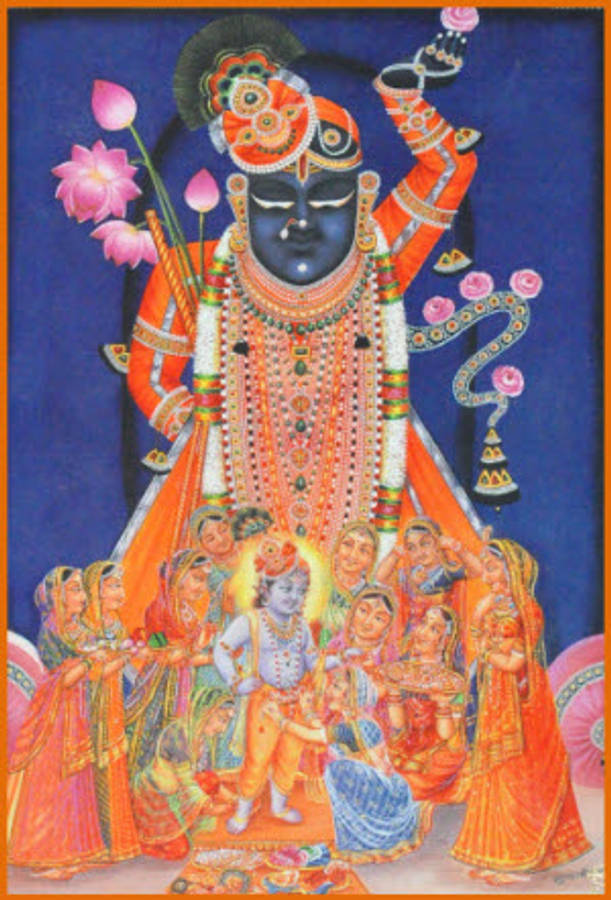 Shrinathji 桌布 壁紙 — 一位色彩鮮豔的印度教神祇，深色皮膚，穿著華麗的橙色服飾，高舉蓮花和三叉戟，周圍環繞著信徒。