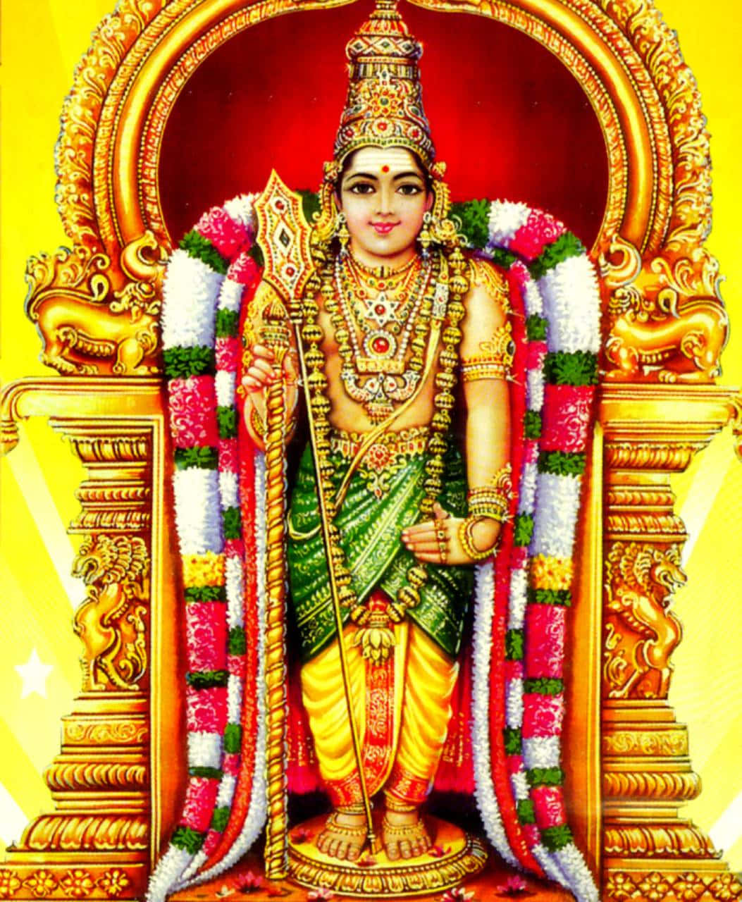 Murugan 桌布 壁紙 — 一位閃耀的印度教神祇，佩戴著黃金首飾和色彩繽紛的花環，莊嚴地站在華麗的金色拱門內。