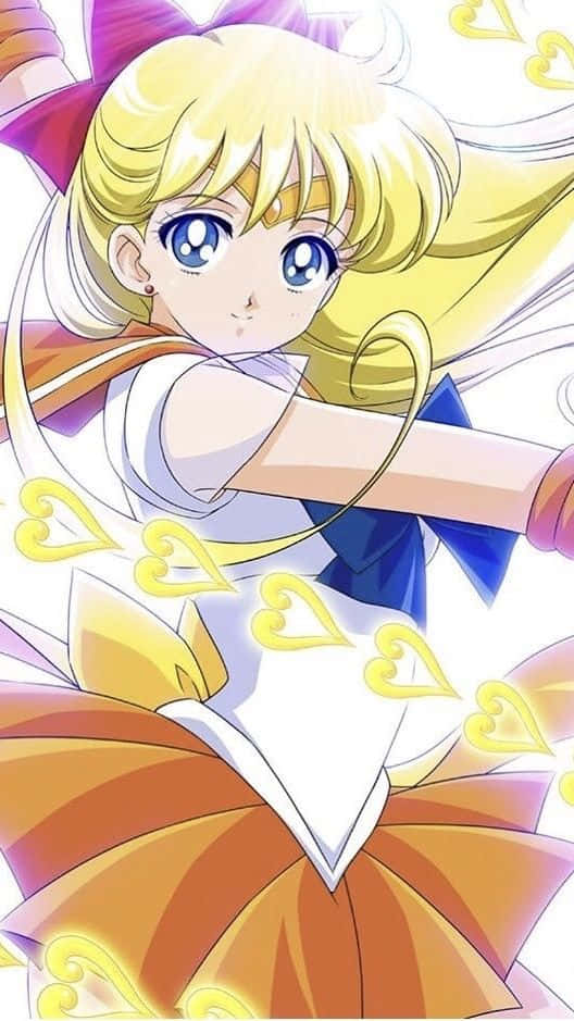 Sailor Venus 桌布 壁紙 — 一位開朗的金髮藍眼動漫女孩，穿著白色和橙色水手服，飾有金色心形，擺出動感姿勢。