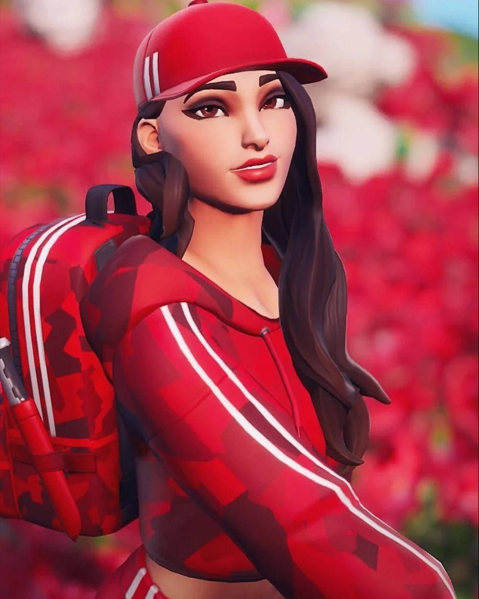 Fortnite 桌布 壁紙 — 一位風格化的女性遊戲玩家，身穿紅色迷彩連帽衫和帽子，自信地站在鮮豔的紅色花卉背景前。