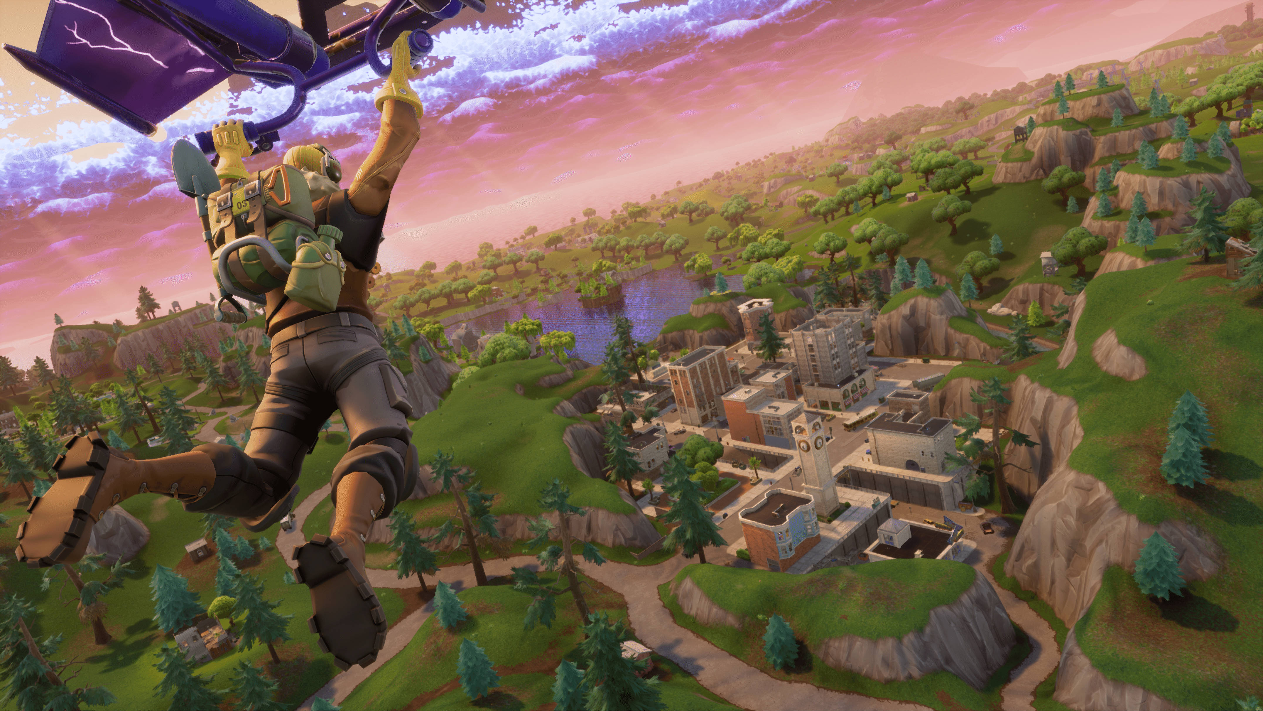 Fortnite 桌布 壁紙 — 一個Fortnite角色喺粉紅色同紫色嘅日落天空下，跳降落傘越過一個充滿活力嘅山谷，山谷中有個小鎮坐落喺綠色山丘之間。