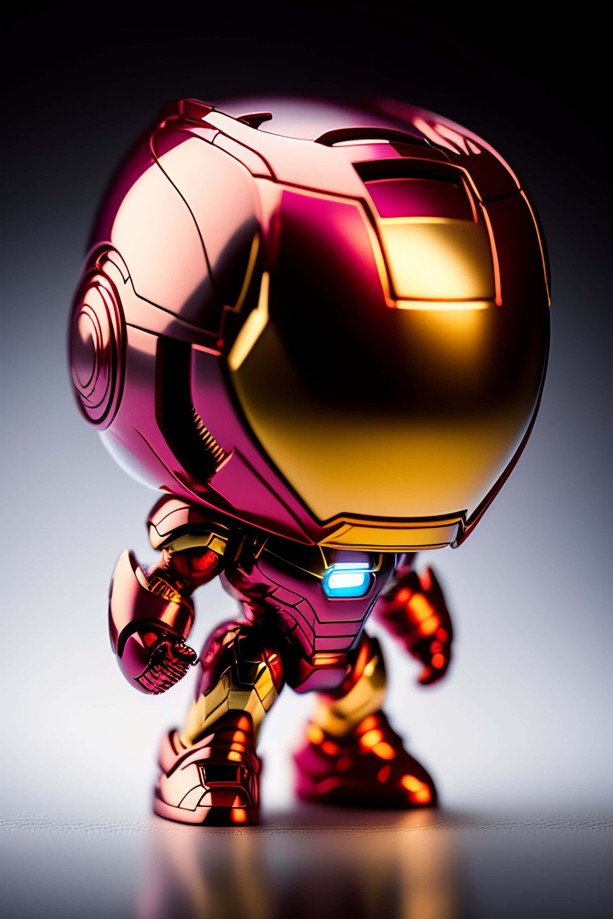 Iron Man Pop Figures 桌布 壁紙 — 一個Q版風格的鐵甲奇俠人偶，胸前發出藍光，在漸變背景前擺出姿勢。