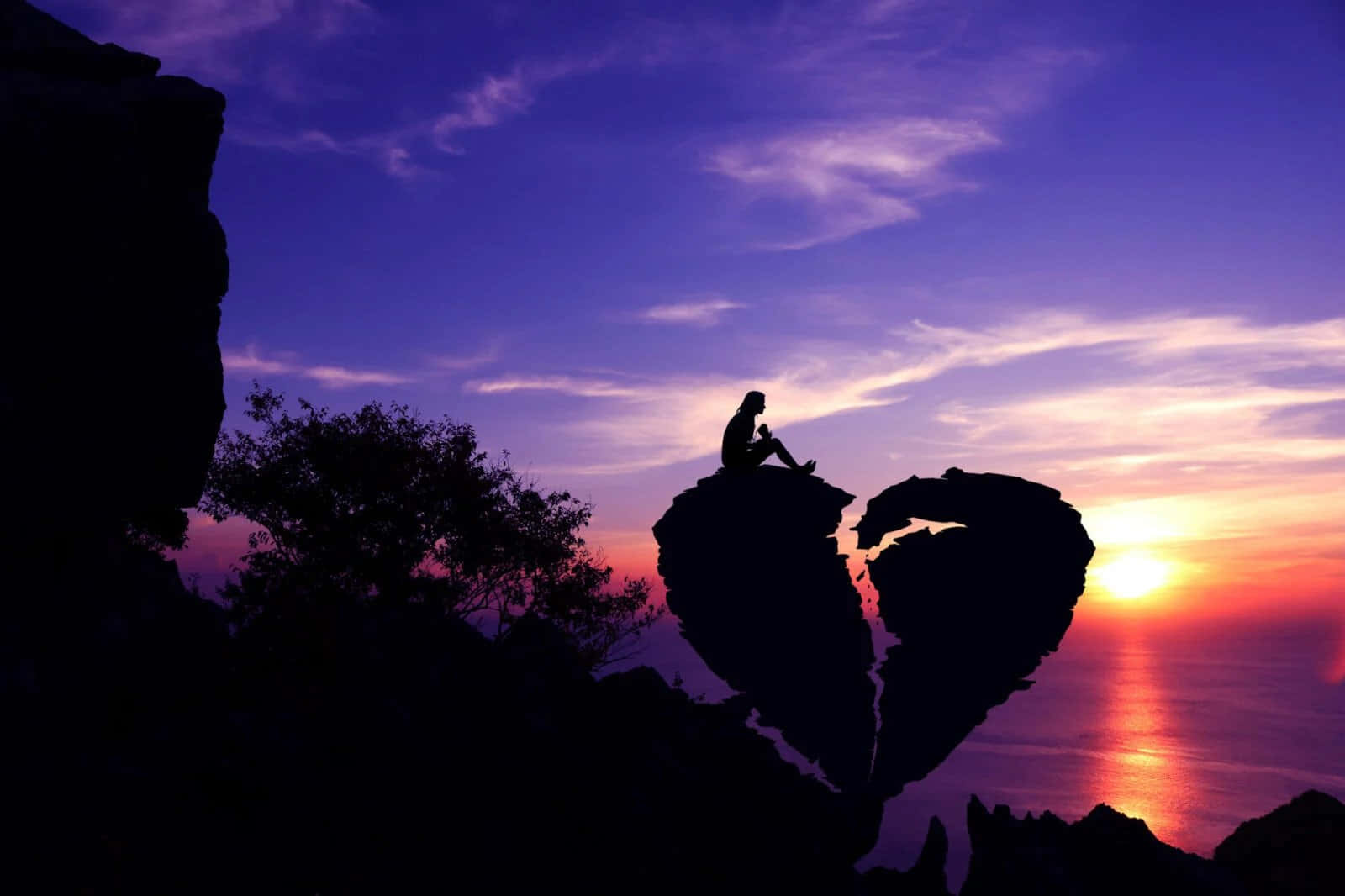 一個人坐在懸崖邊心碎不已 壁紙