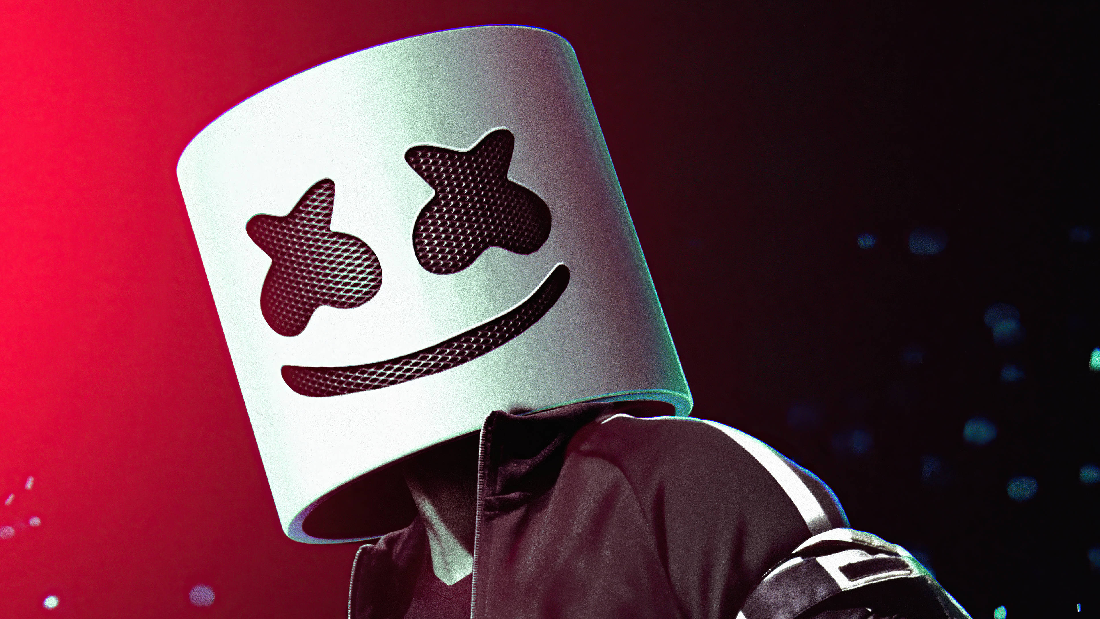 Marshmello 桌布 壁紙 — 一個人戴著一個白色大棉花糖頭盔，上面有星星眼睛和微笑，背景是鮮豔的紅色。