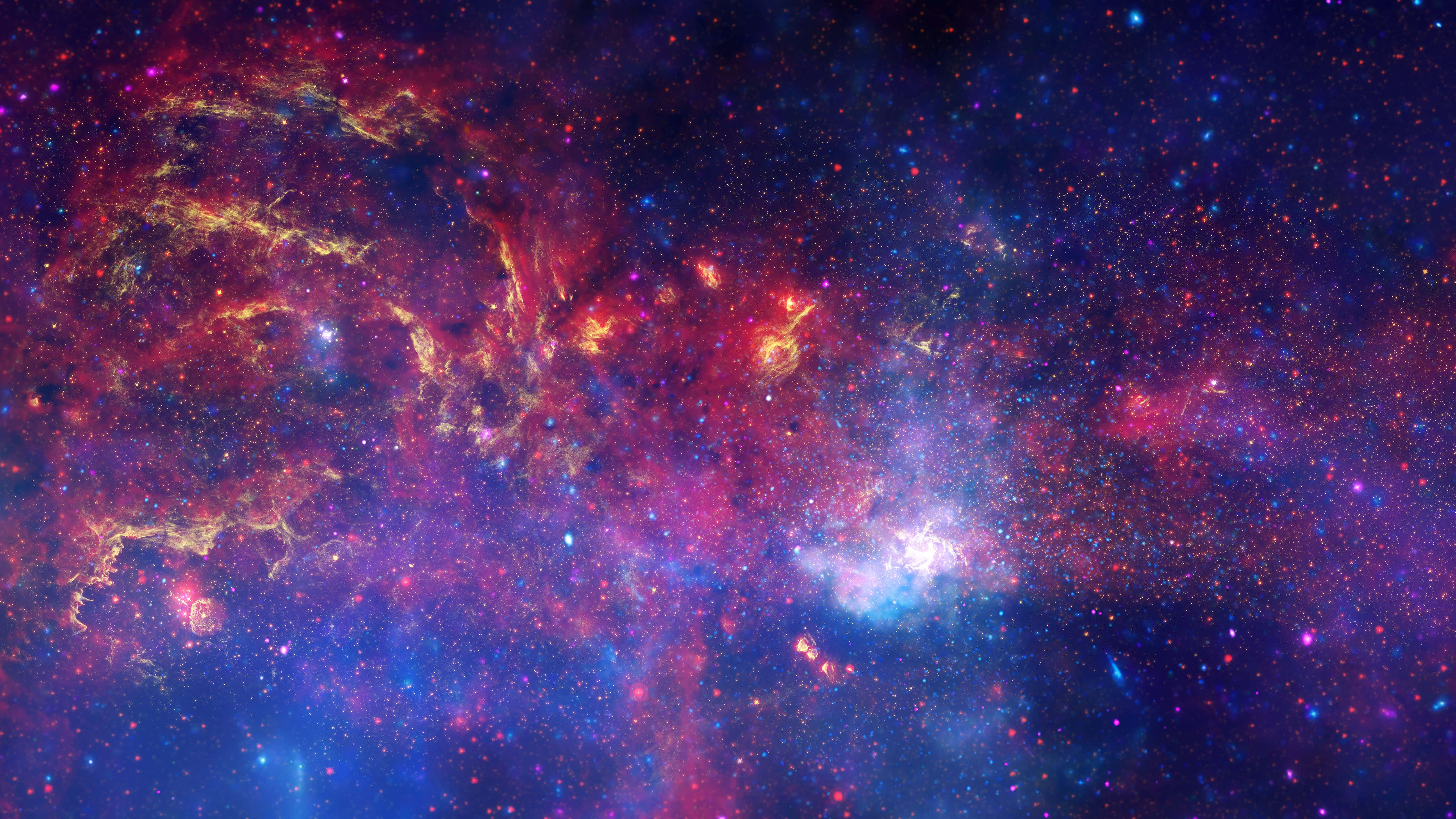Universe 桌布 壁紙 — 一個令人嘆為觀止的宇宙星雲，在星空中旋轉著火紅、金色和深藍色。