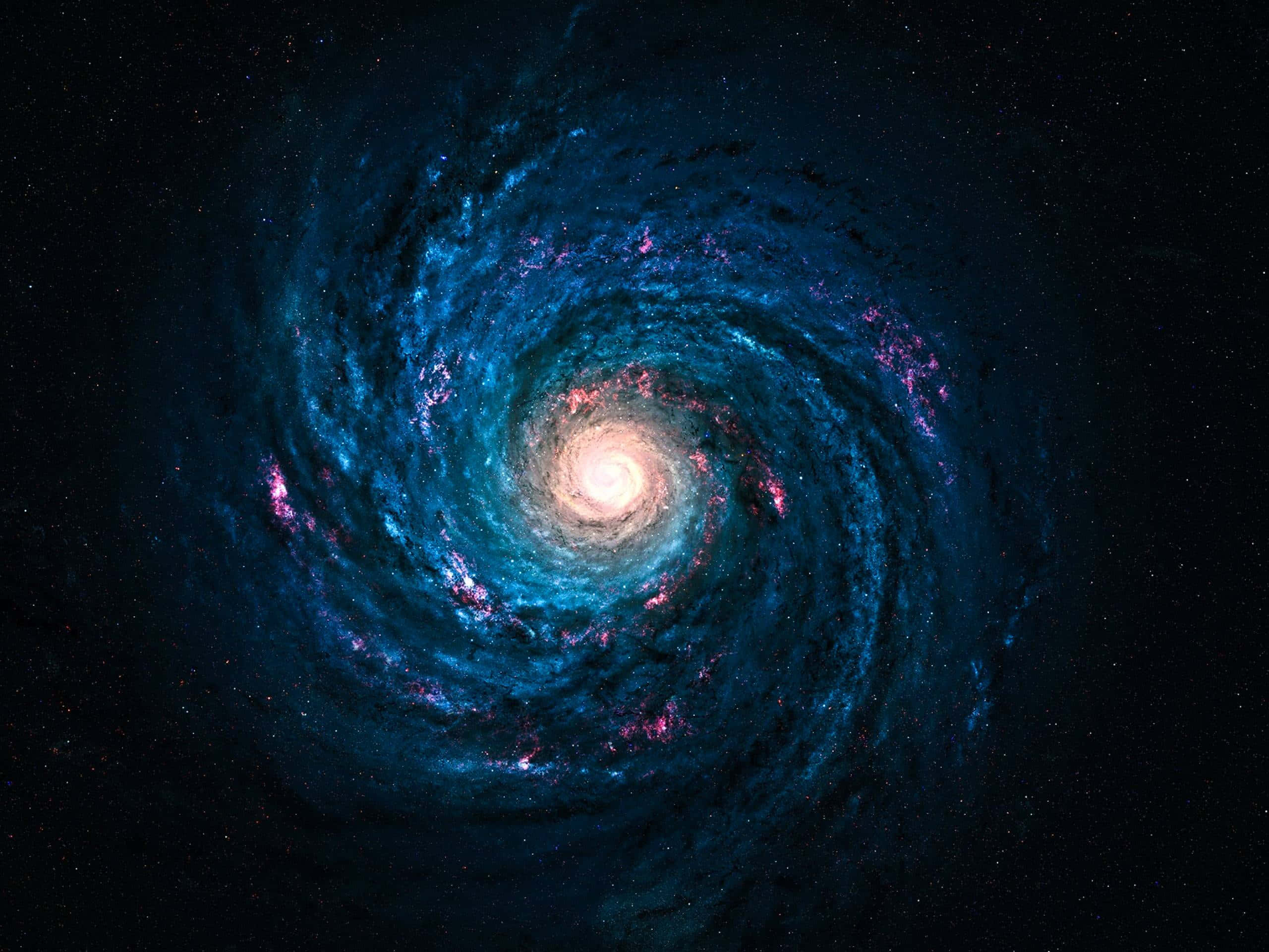 銀河系 桌布 壁紙 — 一個令人嘆為觀止的螺旋星系，在佈滿星辰的宇宙虛空中旋轉著鮮豔的藍色和粉紅色星雲。