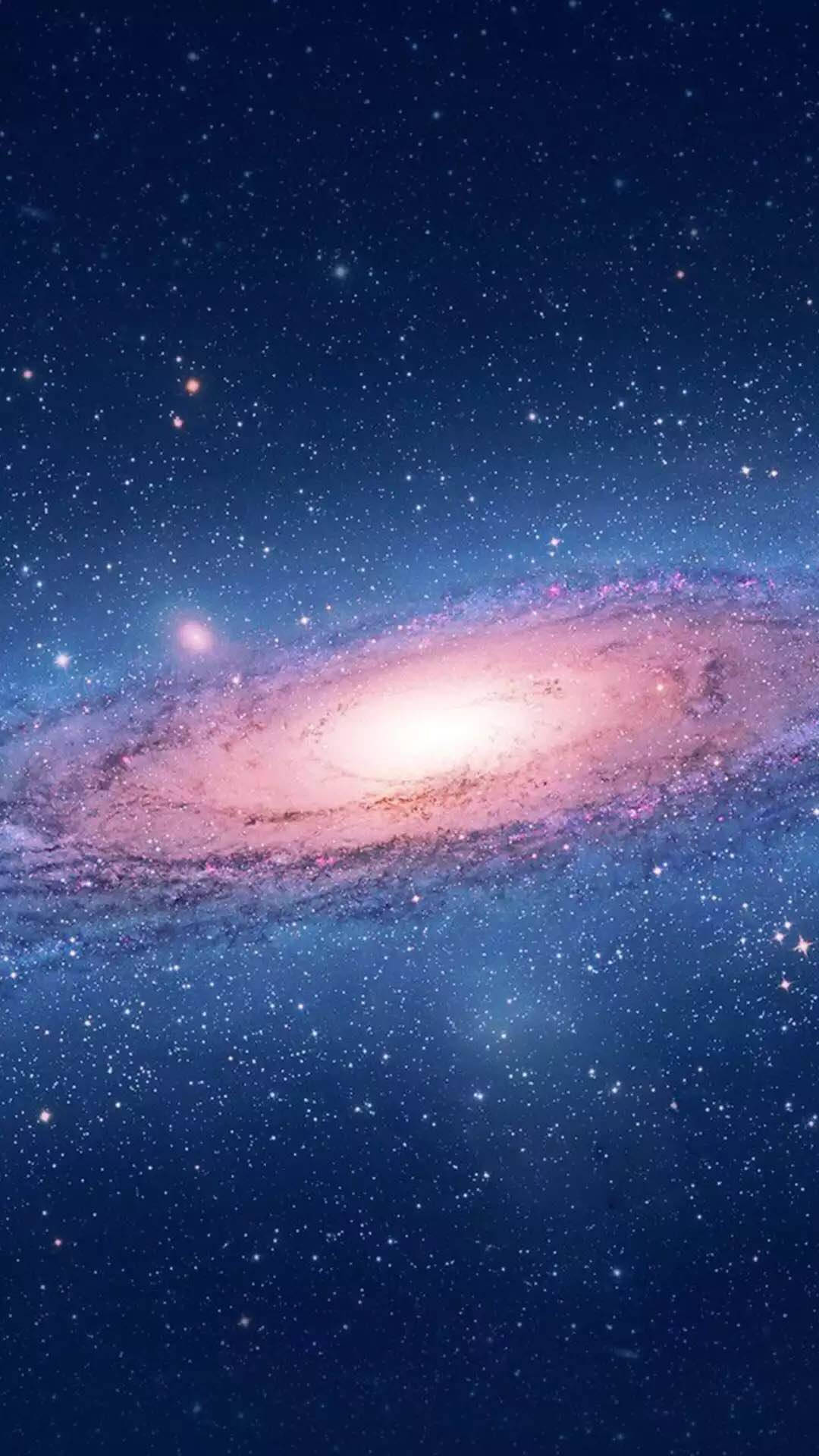 太空 桌布 壁紙 — 一個令人嘆為觀止的螺旋星系，在深藍色星空中散發著粉紅色和白色的光芒。