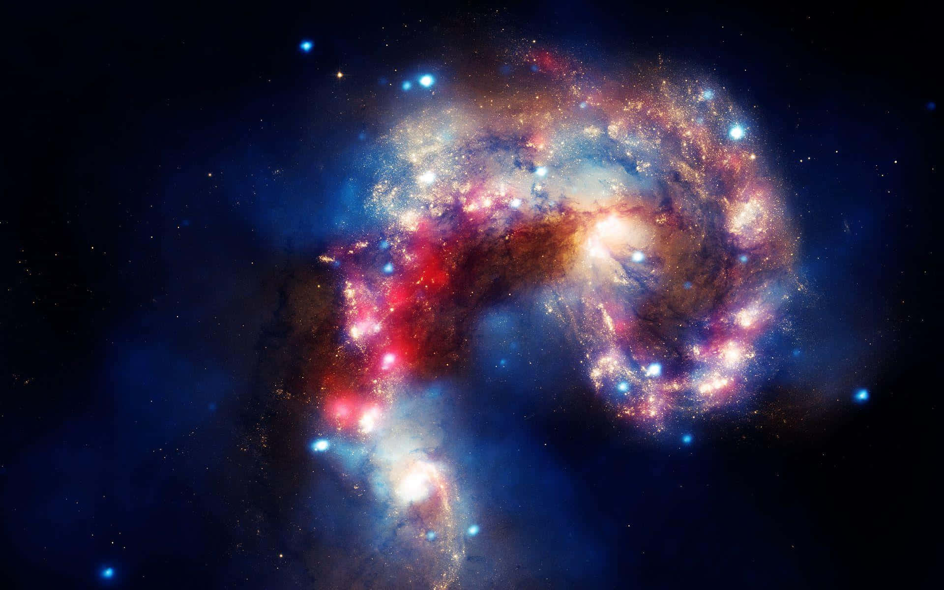 Quasar 桌布 壁紙 — 一個令人嘆為觀止的螺旋星系，在繁星點點的宇宙虛空中，旋轉著鮮豔的紅色、藍色和金色。