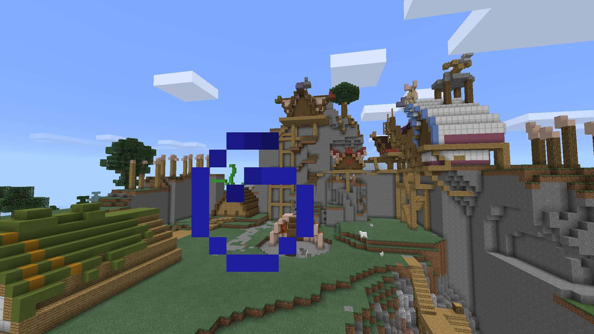 Minecraft Map 桌布 壁紙 — 一個像素化的Minecraft村莊，有木屋、石牆和綠色田野，在晴朗的藍天下有方塊狀的雲朵。