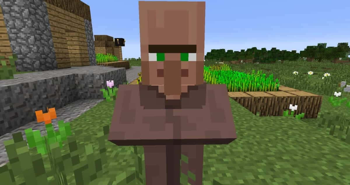 Minecraft Villager 桌布 壁紙 — 一個像素化的Minecraft村民站在有花朵和木製建築物的草地上，天空清澈湛藍。