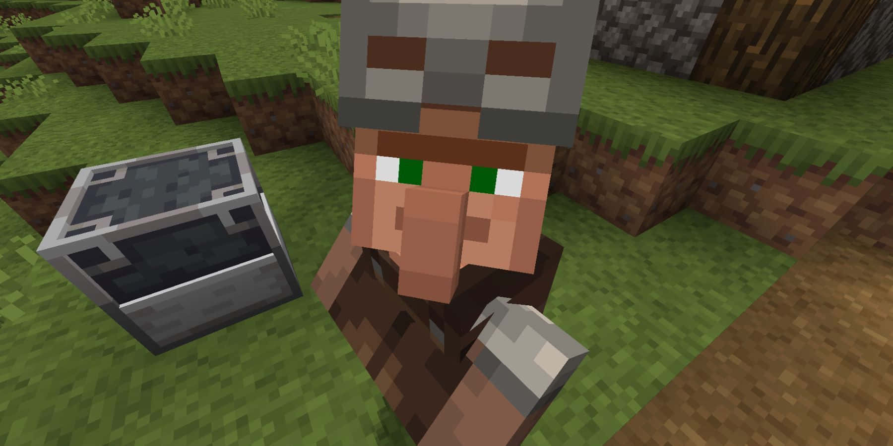 Minecraft Armor 桌布 壁紙 — 一個像素化的Minecraft村民，眼睛綠色，站在一個草地塊狀景觀中的箱子旁邊。