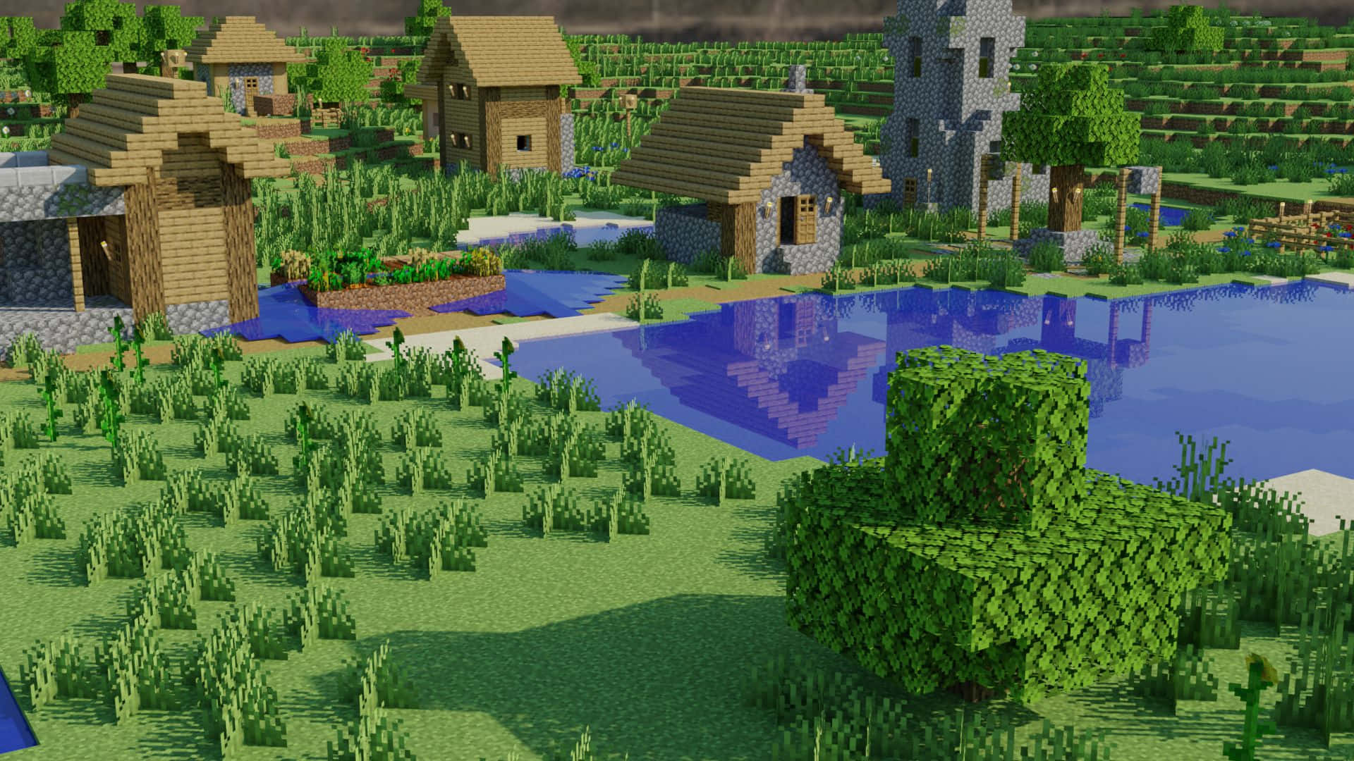 Minecraft Survival 桌布 壁紙 — 一個像素化的Minecraft村莊，有木屋、石塔和反射池塘，周圍是綠草和樹木，天空多雲。
