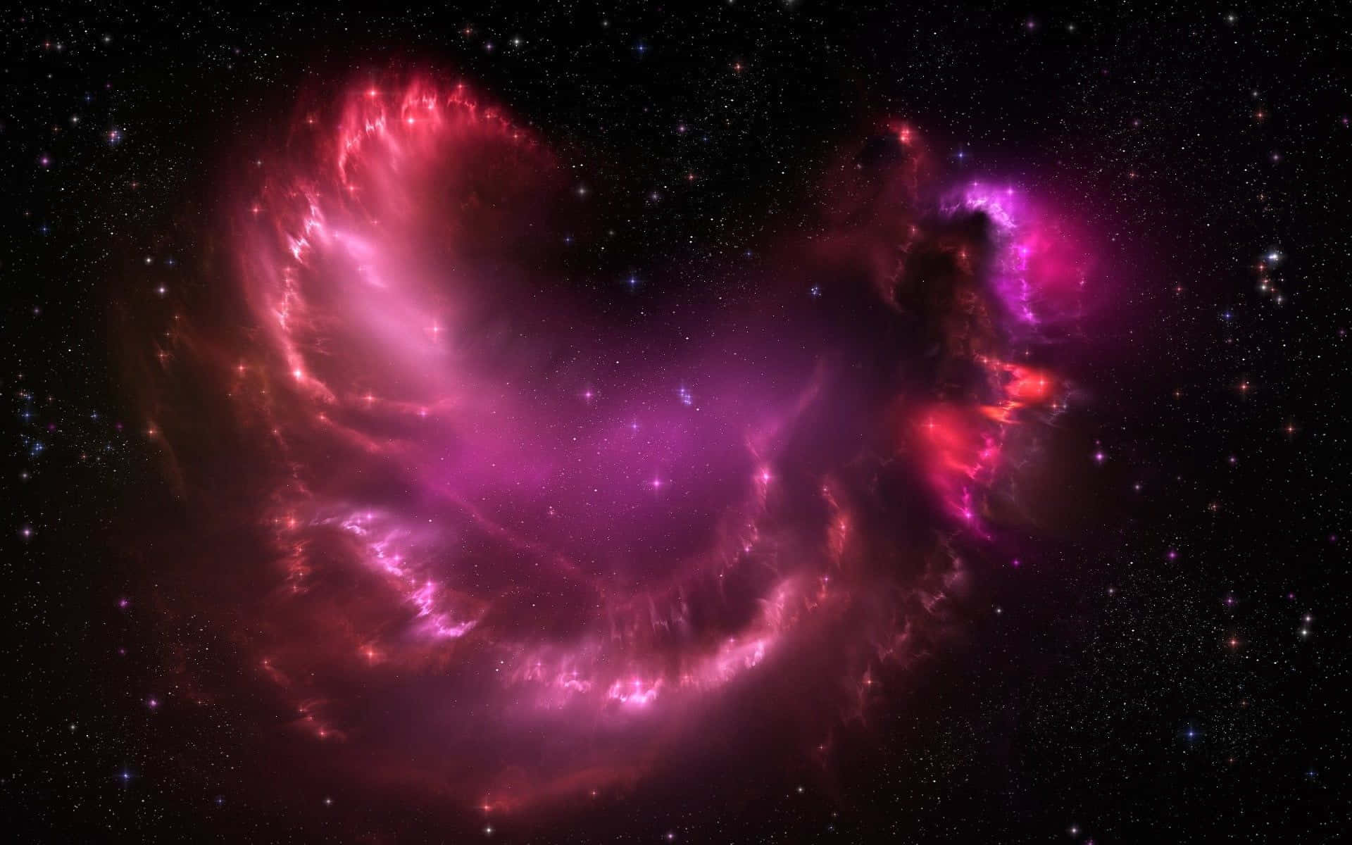 Pink Galaxy 桌布 壁紙 — 一個充滿活力的宇宙星雲，在深空的星場背景下，散發著旋轉的粉紅色和紅色氣體的光芒。