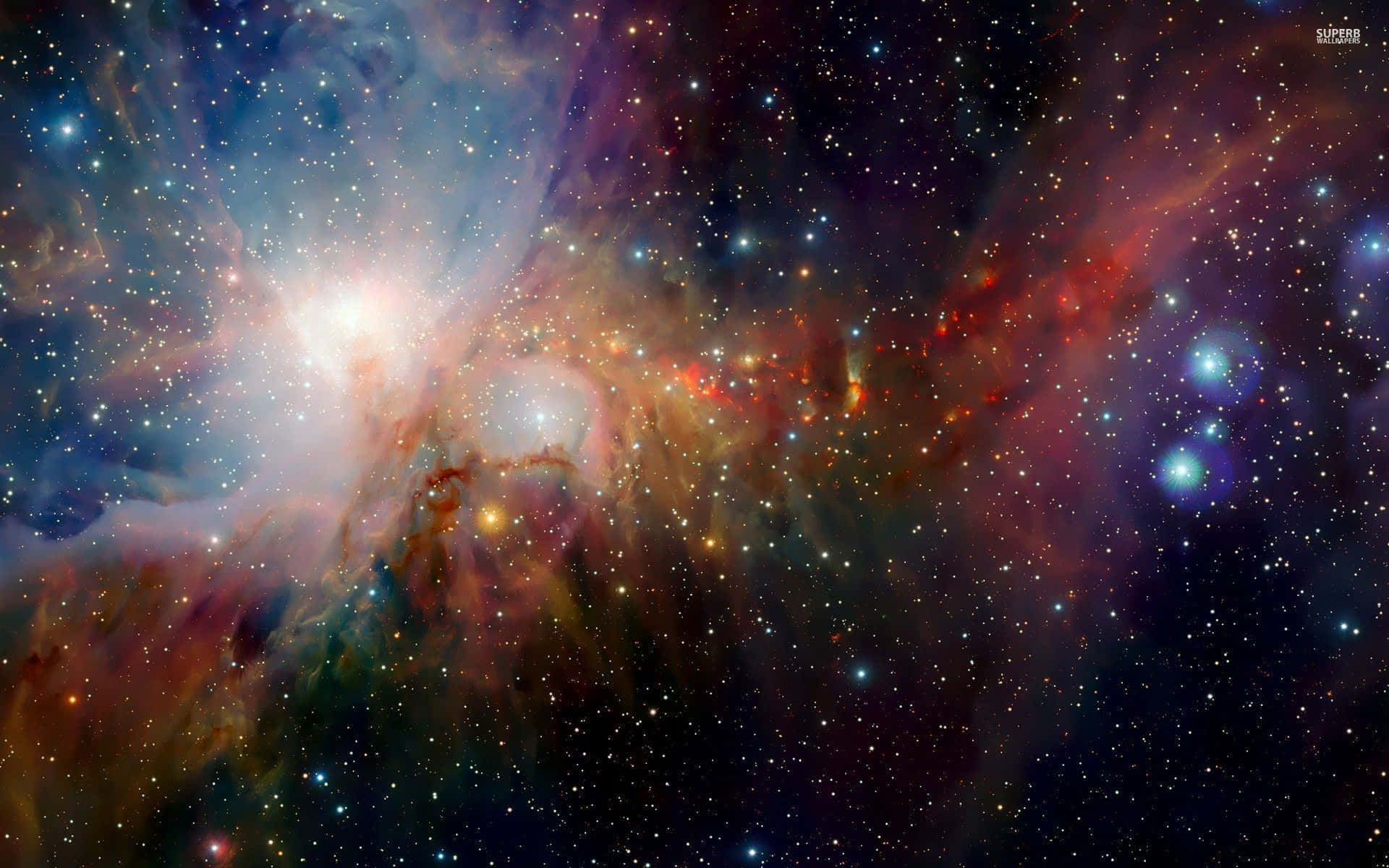 Colorful Space 桌布 壁紙 — 一個充滿活力的宇宙星雲，在深邃的太空背景下，旋轉著發光的氣體和無數的星星。