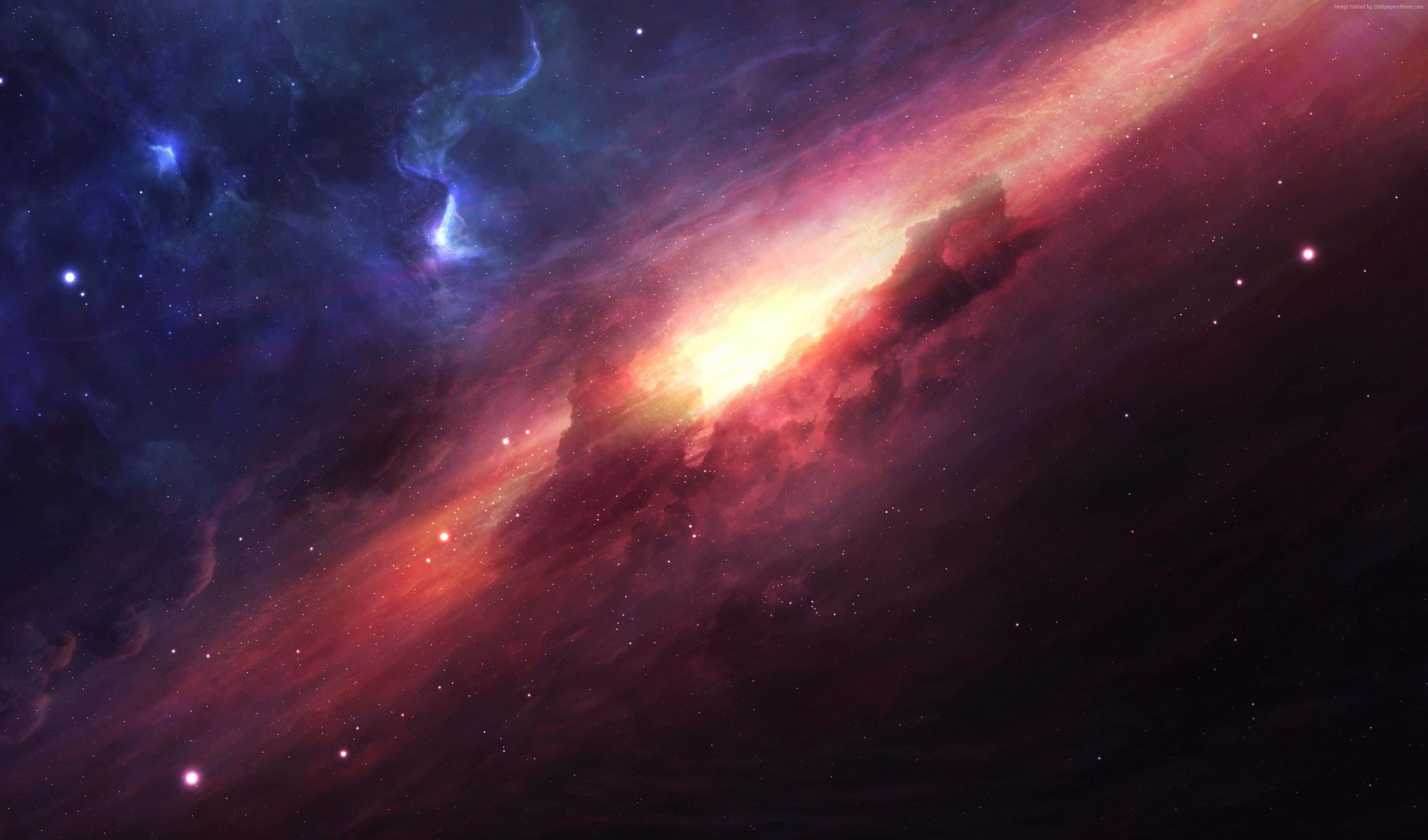 Galaxy Themed Paintings 桌布 壁紙 — 一個充滿活力的宇宙星雲在佈滿星星的虛空中旋轉，呈現出火紅和深藍色。