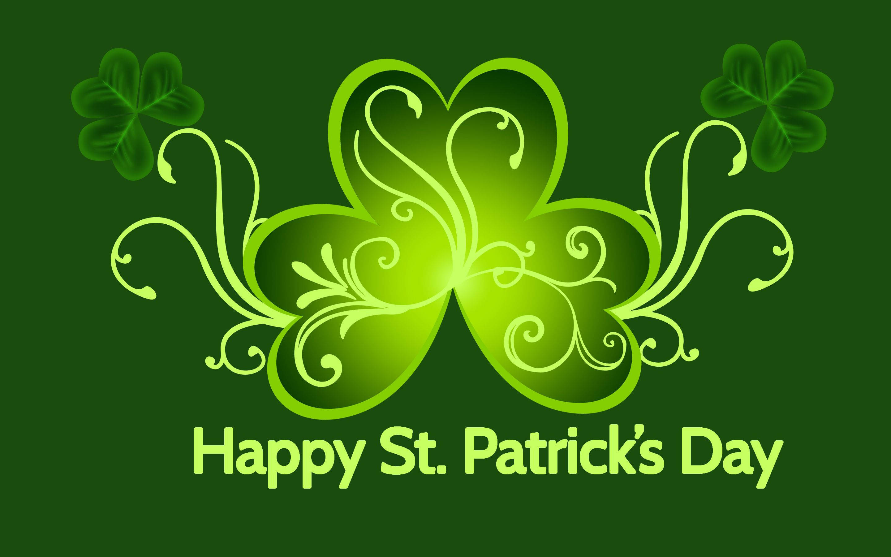 happy st patricks day birthday 桌布 壁紙 — 一個充滿活力的綠色裝飾三葉草，帶有旋轉藤蔓和發光中心，置於深綠色背景上，下方有文字。