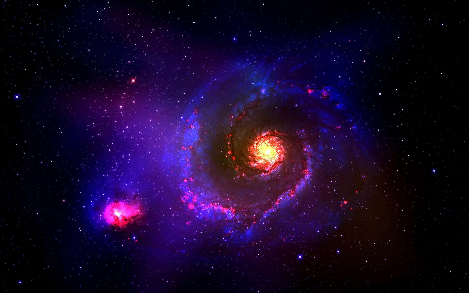 Universe 桌布 壁紙 — 一個充滿活力的螺旋星系，帶有發光的紅色和藍色旋臂，在星空背景下旋轉。