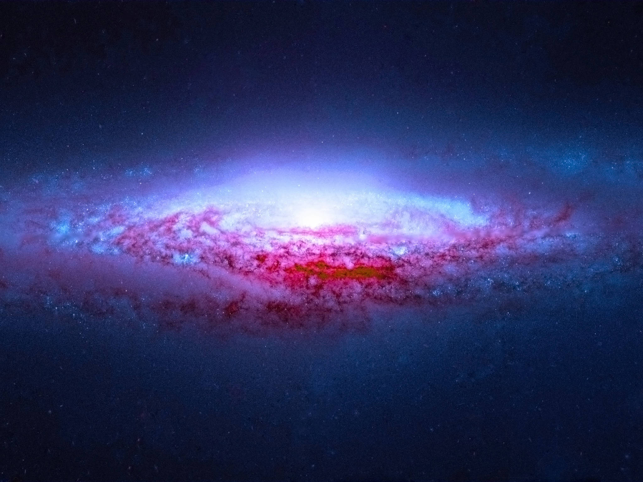 宇宙 桌布 壁紙 — 一個充滿活力的螺旋星系在繁星點點的宇宙背景下閃耀著粉紅色和藍色的星雲。