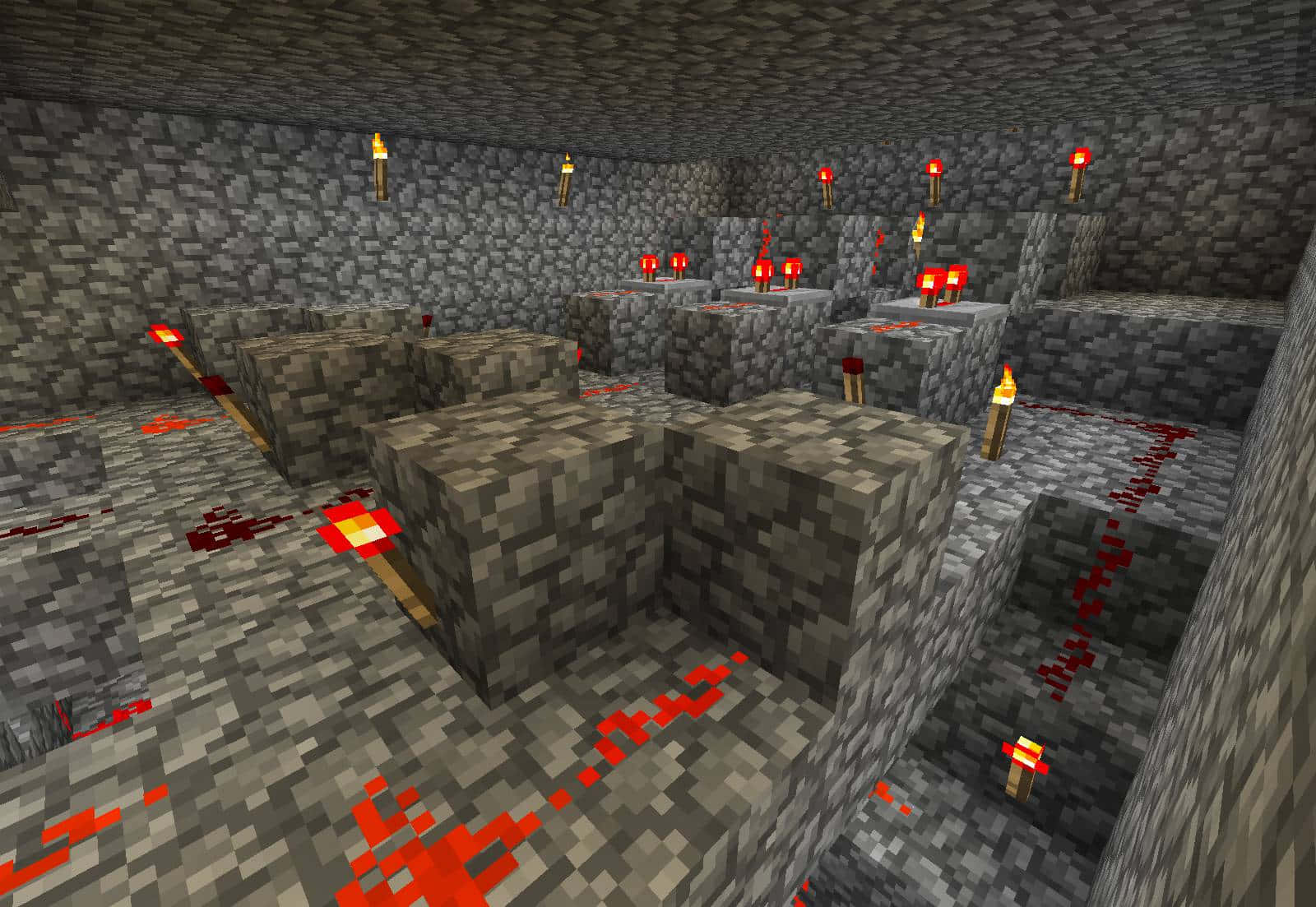 Minecraft Redstone 桌布 壁紙 — 一個光線昏暗的 Minecraft 地下洞穴，有石塊、熔岩池和火炬，在像素牆壁上投射出溫暖的光芒。