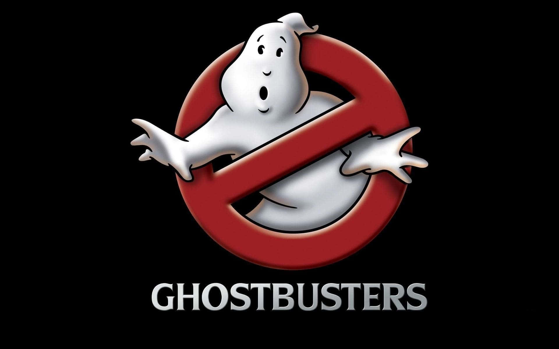 Ghostbusters 桌布 壁紙 — 一個卡通鬼魂睜大眼睛、伸出雙臂，被困在紅色禁止標誌內，背景為黑色，下方有「GHOSTBUSTERS」字樣。
