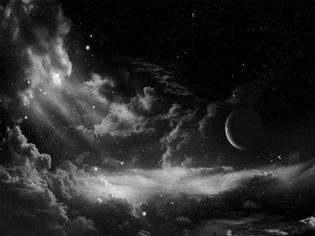 Dark Sky 桌布 壁紙 — 一個單色宇宙場景，有旋轉的星雲、星星，以及一彎新月穿過戲劇性的雲層發光。