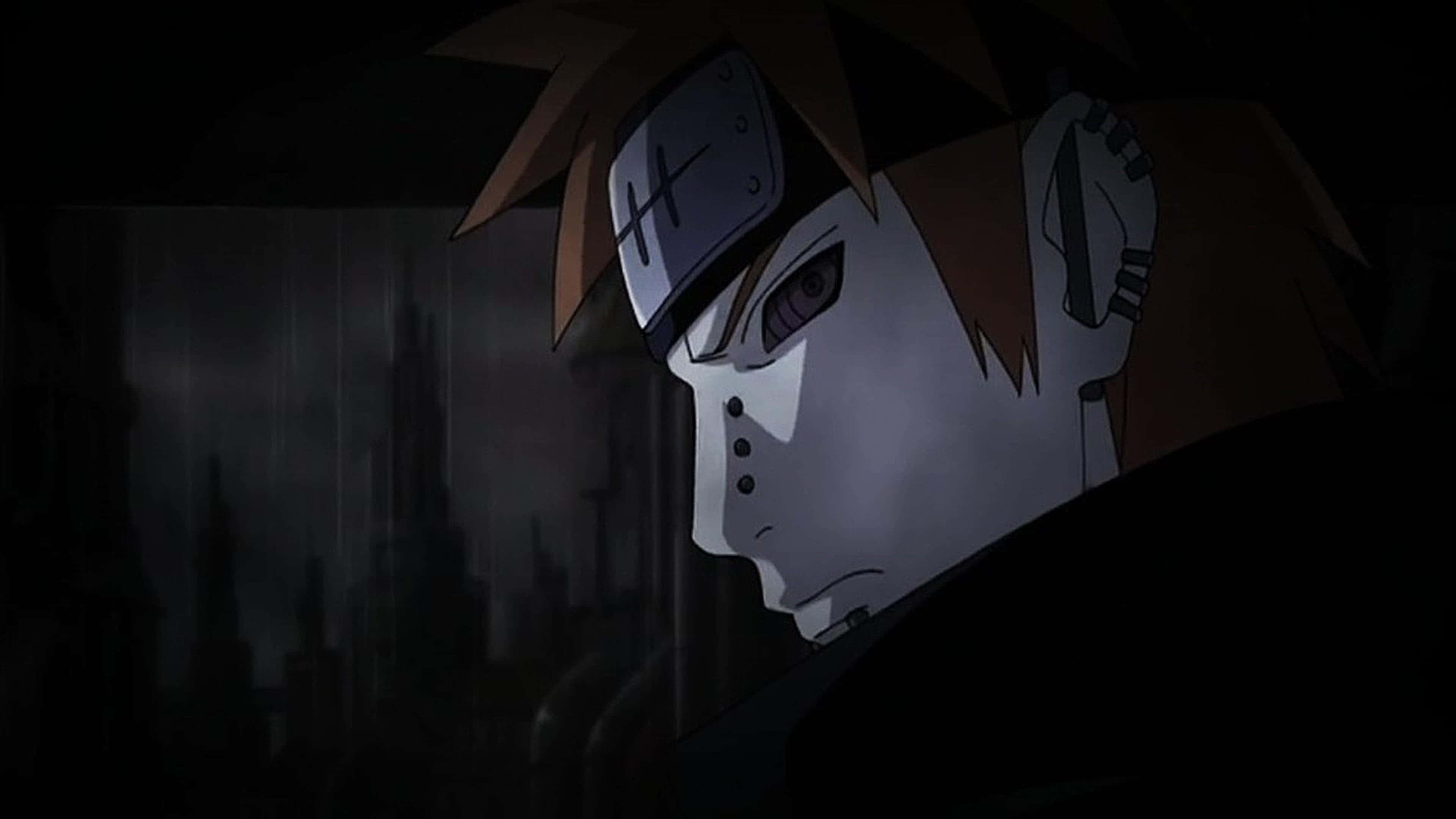 Akatsuki Ninja 桌布 壁紙 — 一個嚴肅的動漫角色，擁有尖刺的棕色頭髮和頭帶，在黑暗多雨的城市景觀中向下凝視。