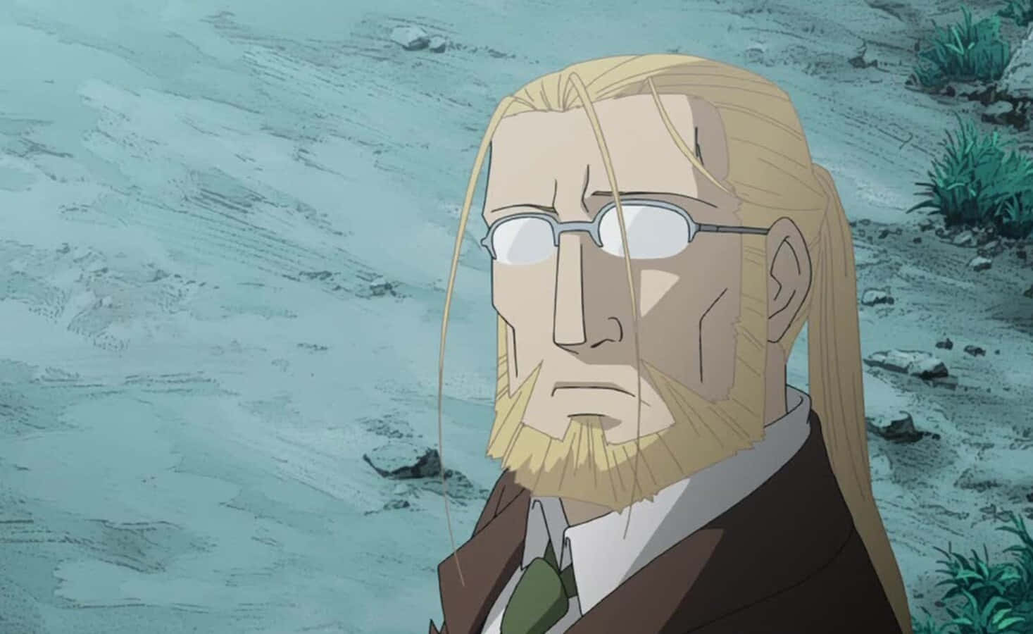 Van Hohenheim 桌布 壁紙 — 一個嚴肅的動畫男人，金髮戴眼鏡，站在荒涼多石的風景中，天空暗淡。