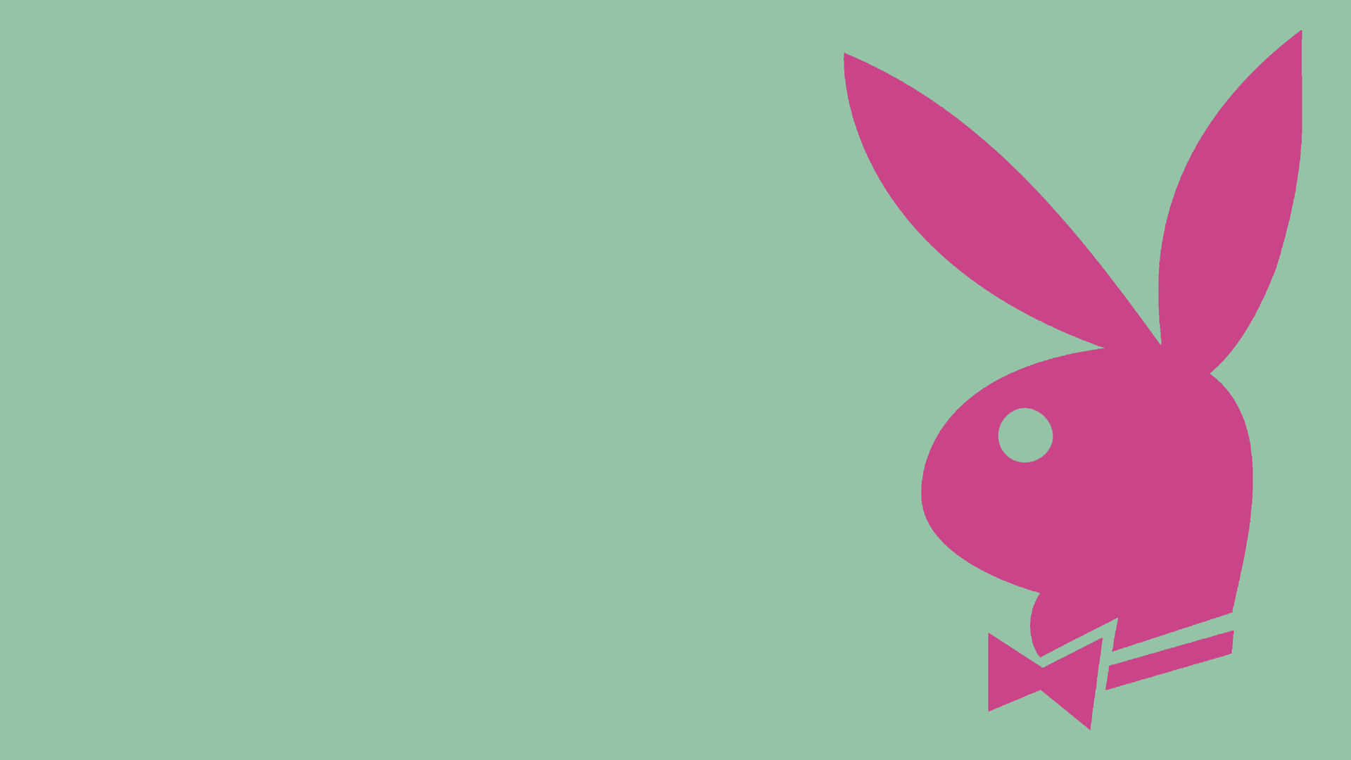 Playboy Aesthetic 桌布 壁紙 — 一個大膽的粉紅色Playboy兔仔標誌配蝴蝶結，在純薄荷綠色背景上格外突出。