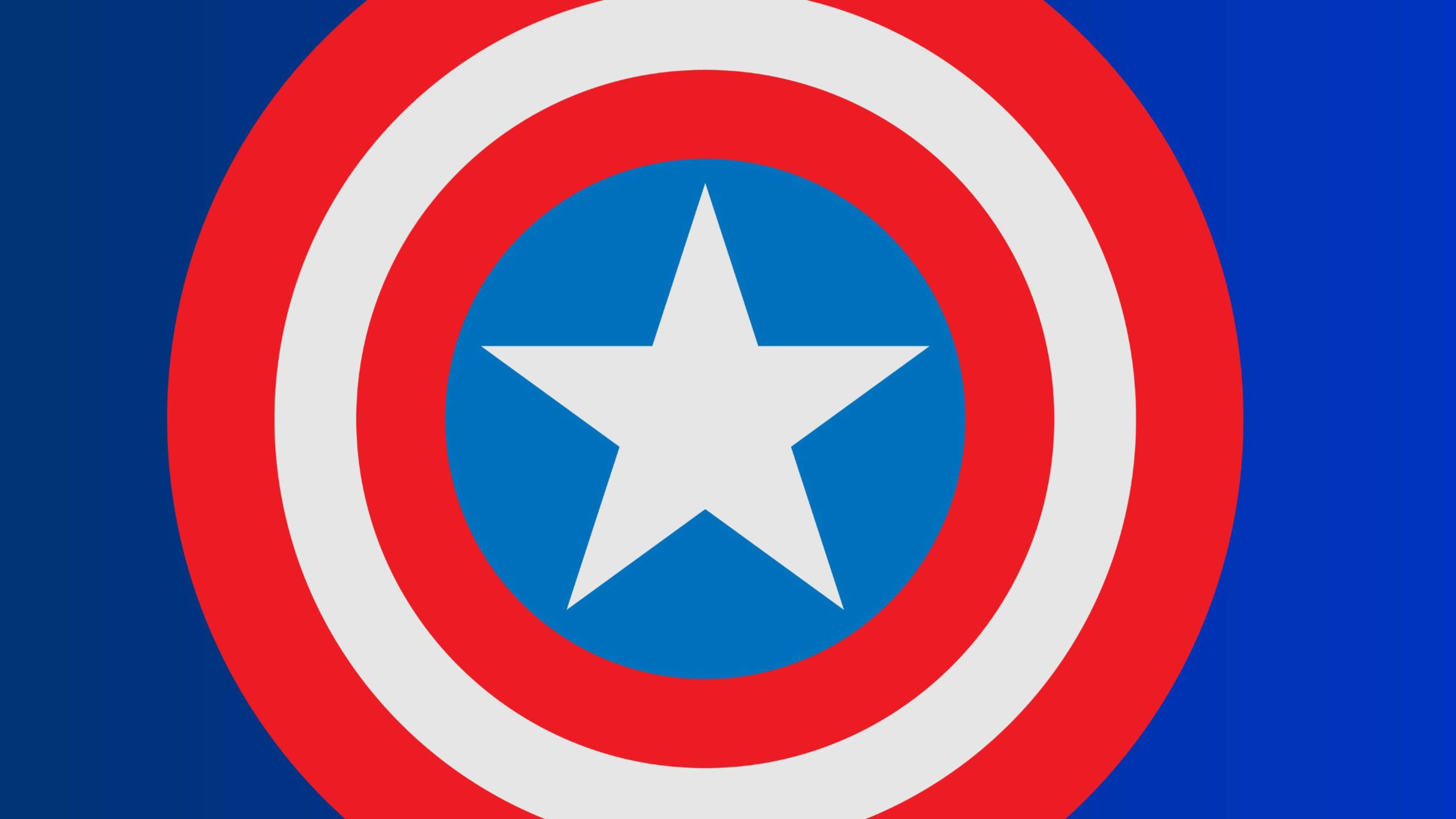 4K Captain America 桌布 壁紙 — 一個大膽的紅、白、藍色美國隊長盾牌，置於深藍色漸變背景中央。