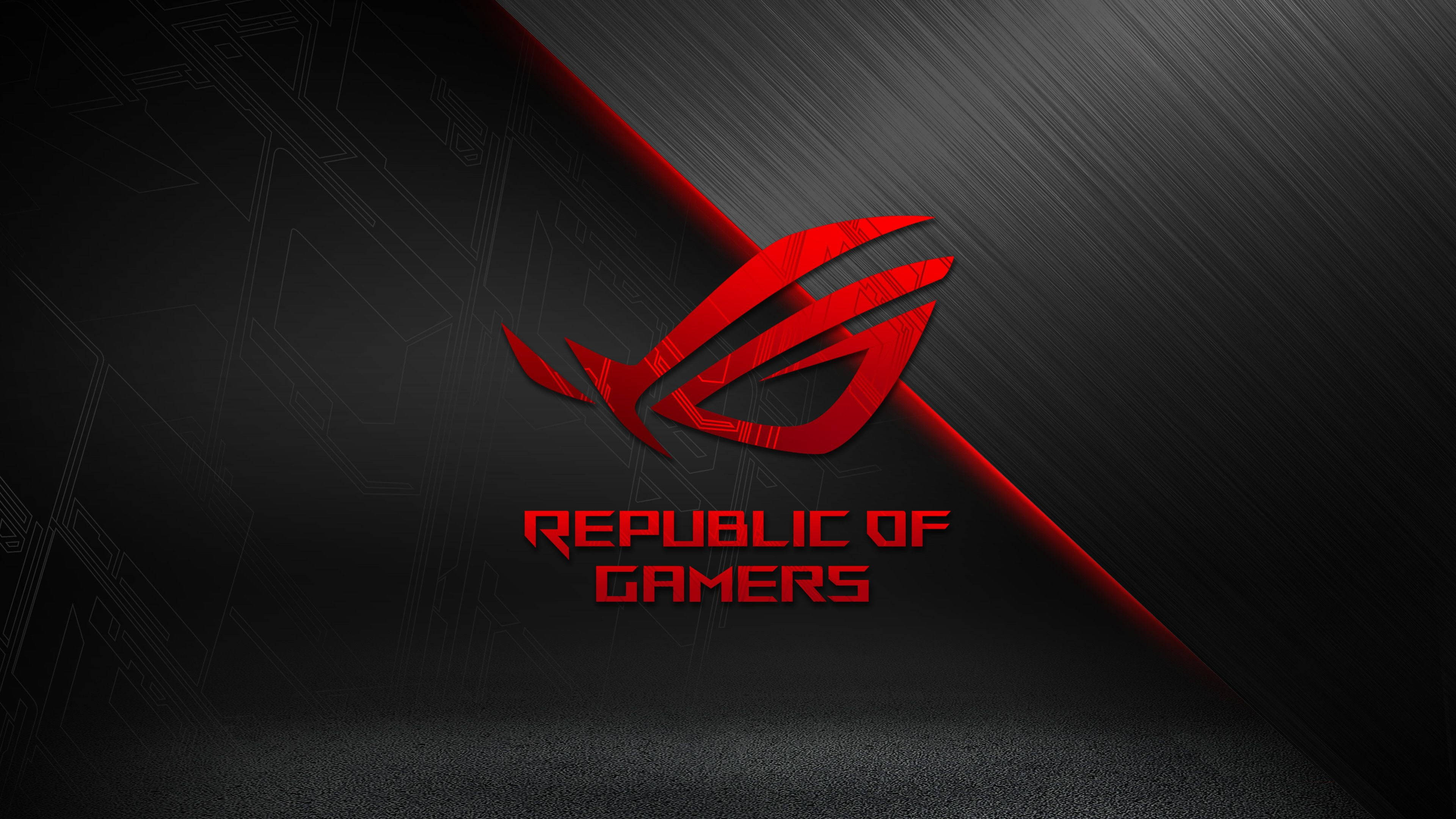 ASUS ROG 桌布 壁紙 — 一個大膽的紅色Republic of Gamers標誌在帶有對角光線條的時尚黑色紋理背景上發光。