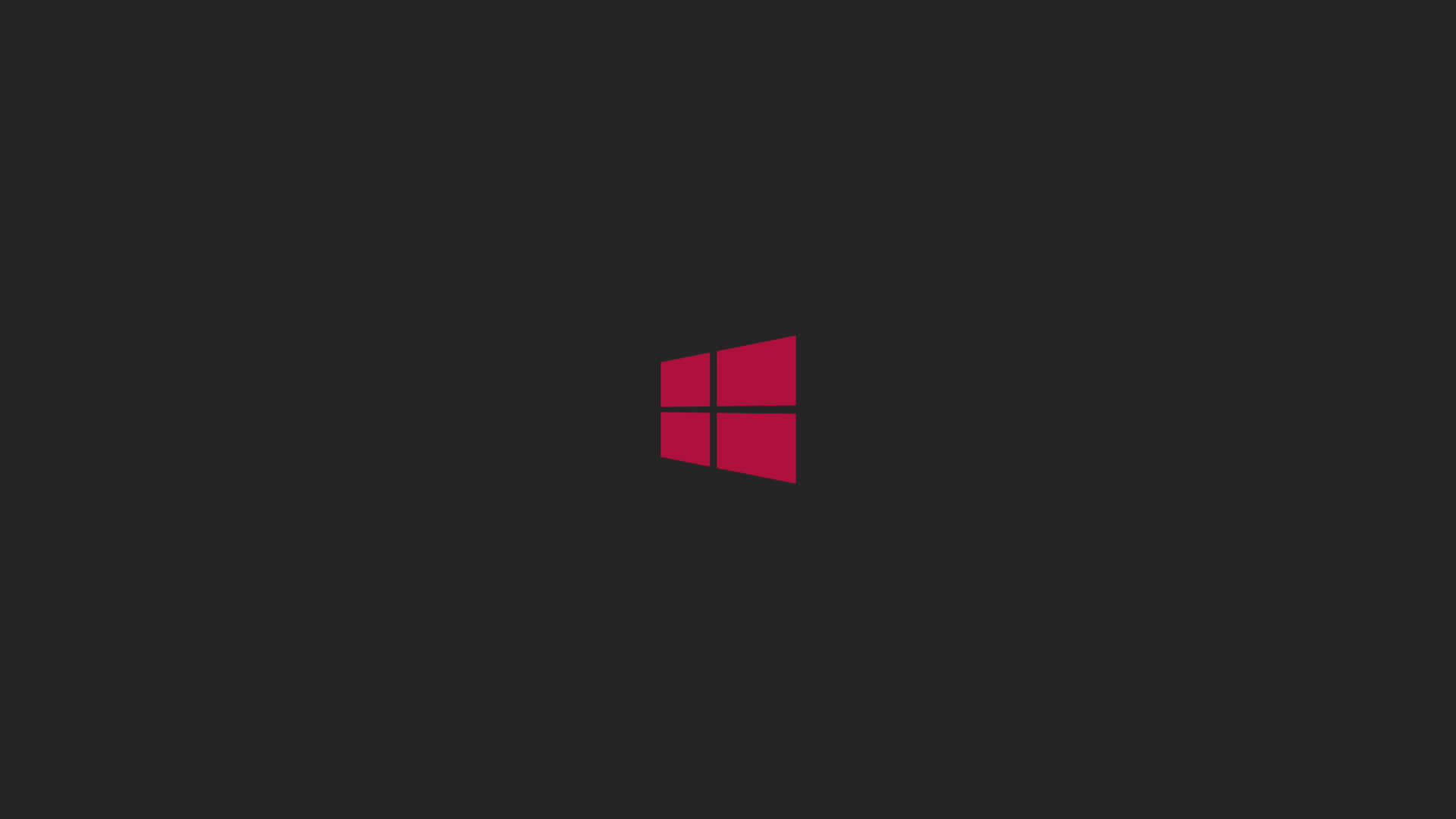 Windows 8 桌布 壁紙 — 一個大膽的紅色Windows標誌居中在純深灰色背景上。