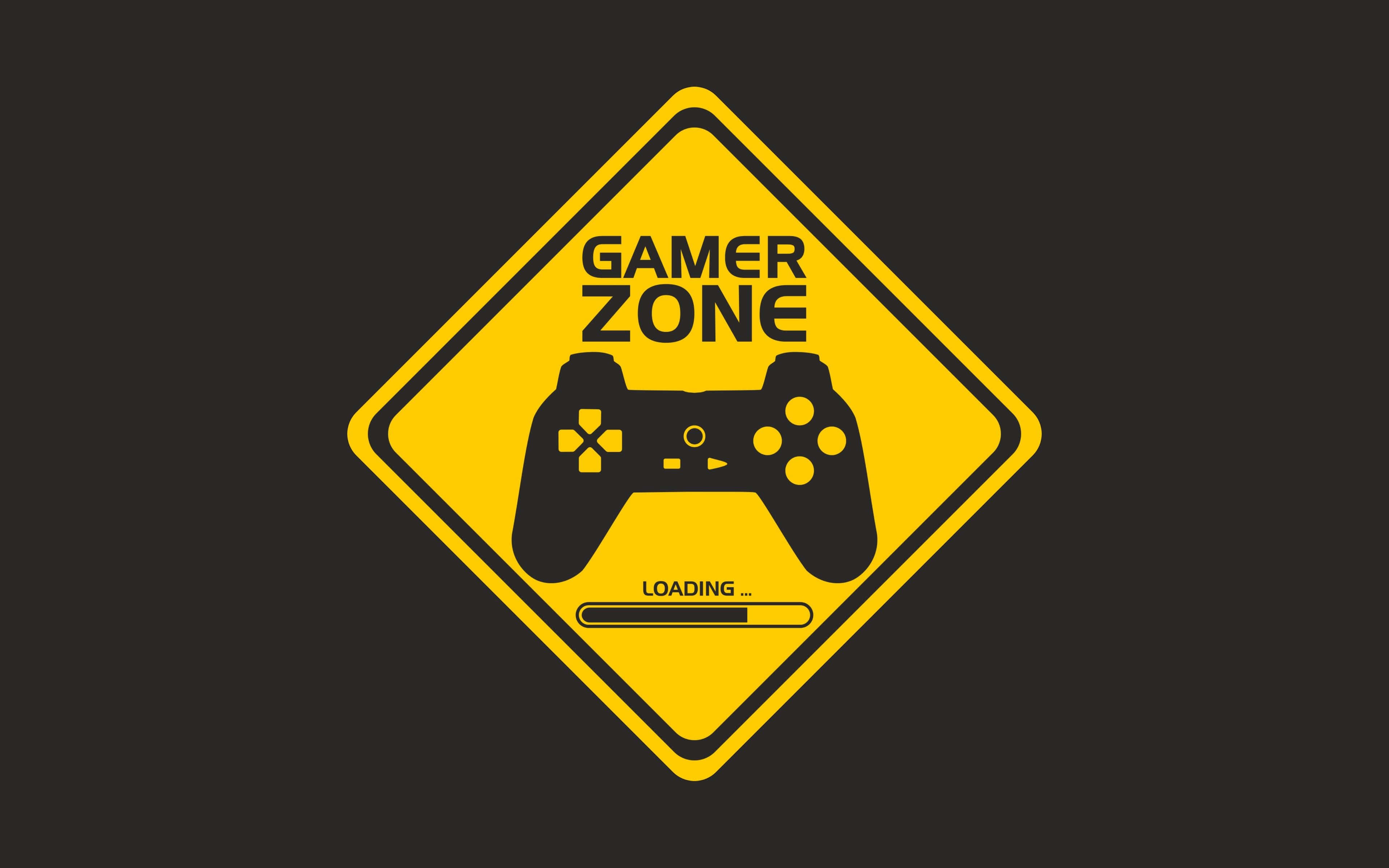 Pro Gamer 桌布 壁紙 — 一個大膽的黃色菱形道路標誌，在深色背景上宣告「GAMER ZONE」，帶有黑色遊戲控制器和加載條。